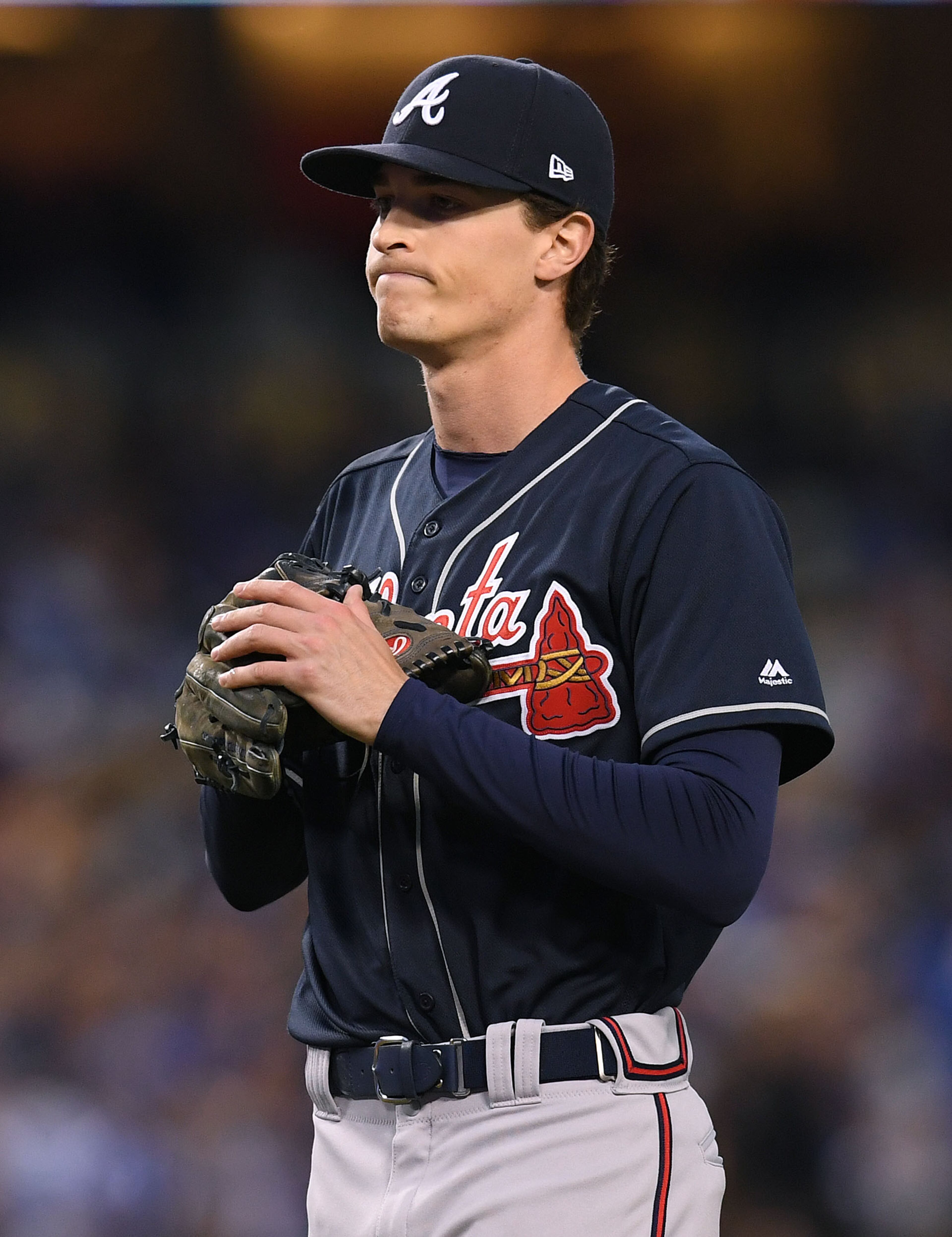Max Fried #54 of the Atlanta Braves reacts after his wild pitch to the Los Angeles Dodgers during the first inning at Dodger Stadium on May 08, 2019 in Los Angeles, California. (Photo by Harry How/Getty Images)