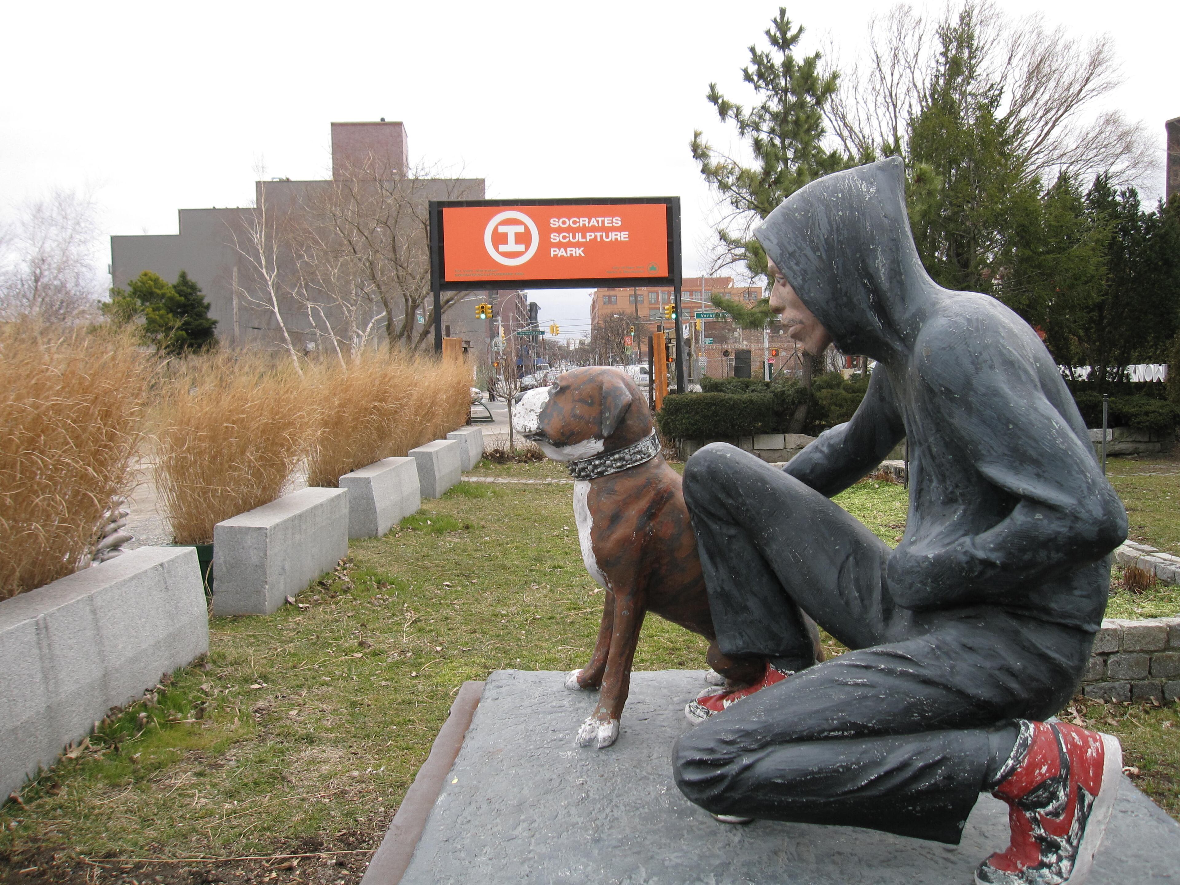 This March 6, 2013, photo shows "Raymond & Toby," a 1994 sculpture by John Ahearn at Socrates Sculpture Park in the Astoria section of the Queens borough of New York. The waterfront park is one of several art-related attractions in Astoria and the adjacent neighborhood of Long Island City. A boom in moderately priced hotels in Long Island City has begun luring tourists to the area. Along with museums, parks, hotels and ethnic restaurants, the area is still home to a large industrial base, from auto shops to factories.