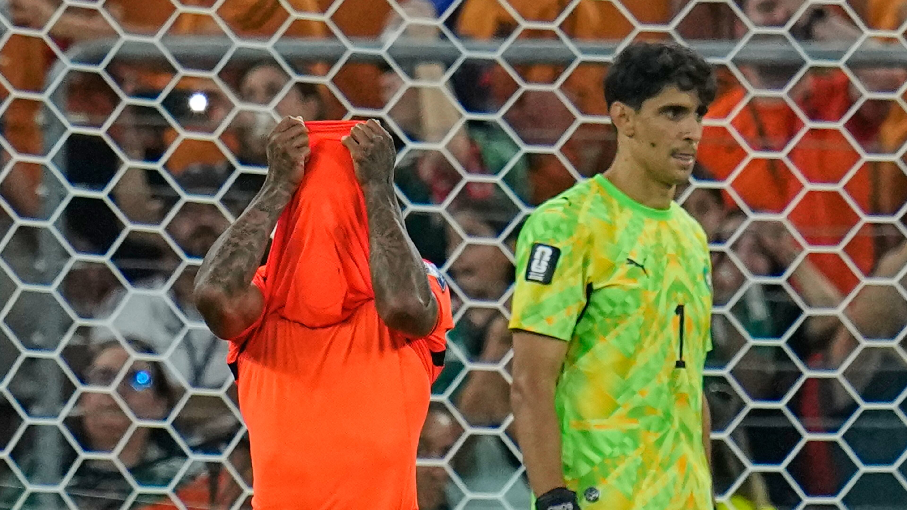 Netherlands' Crysencio Summerville (24) reacts after missing a penalty as Morocco goalkeeper Yassine Bounou (1) walks past during the World Cup round of 32 soccer match between the Netherlands and Morocco in Guadalupe, near Monterrey, Mexico, Monday, June 29, 2026. (AP Photo/Ricardo Mazalan)