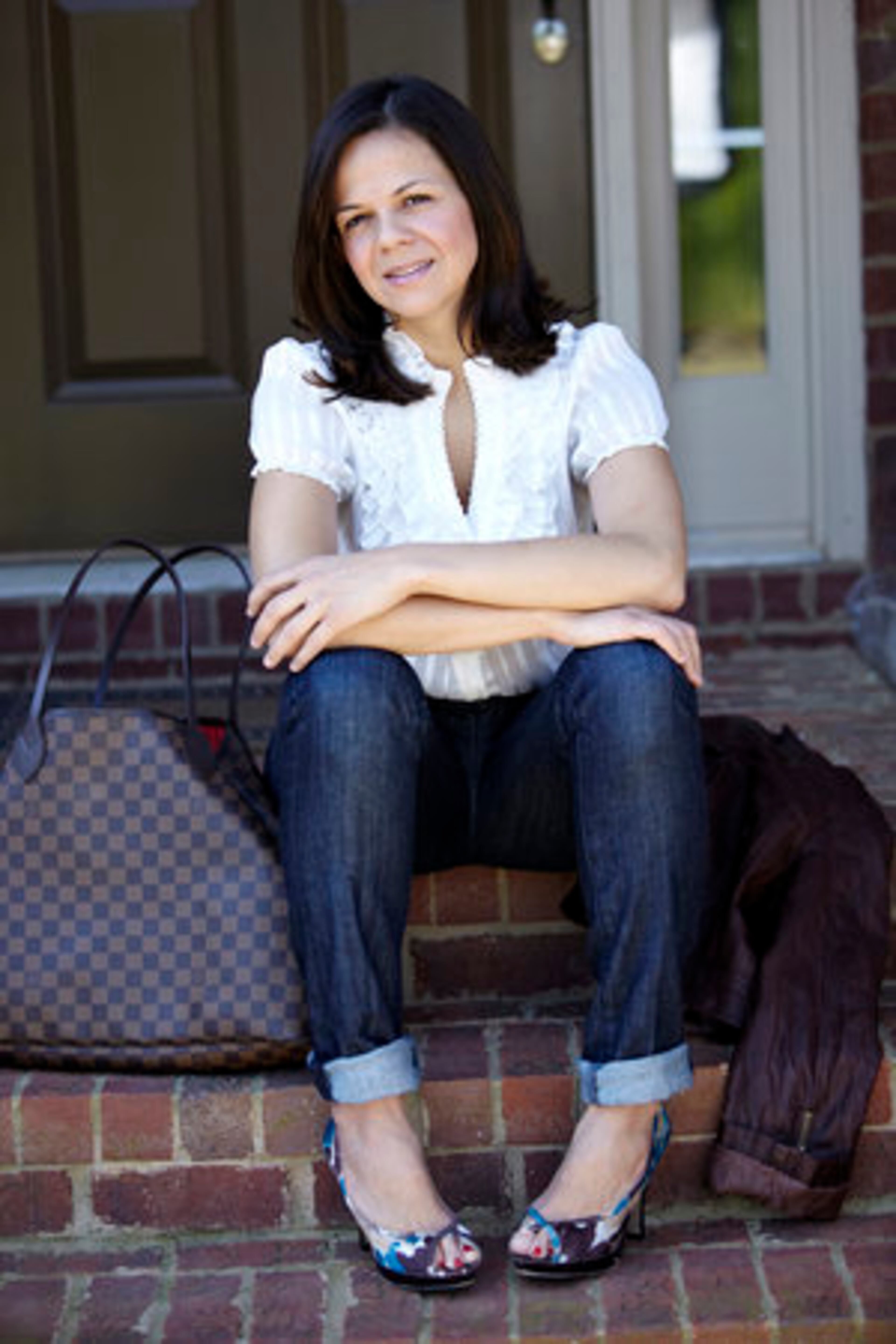 SIGNATURE STYLE: "I love the mixture between casual and chic. I spend hours playing with clothes; matching stuff before going out." Here, she wears 7 for All Mankind jeans with an Express blouse and Madden Girl heels. She accessorizes with her Louis Vuitton bag and leather jacket from Forever 21.