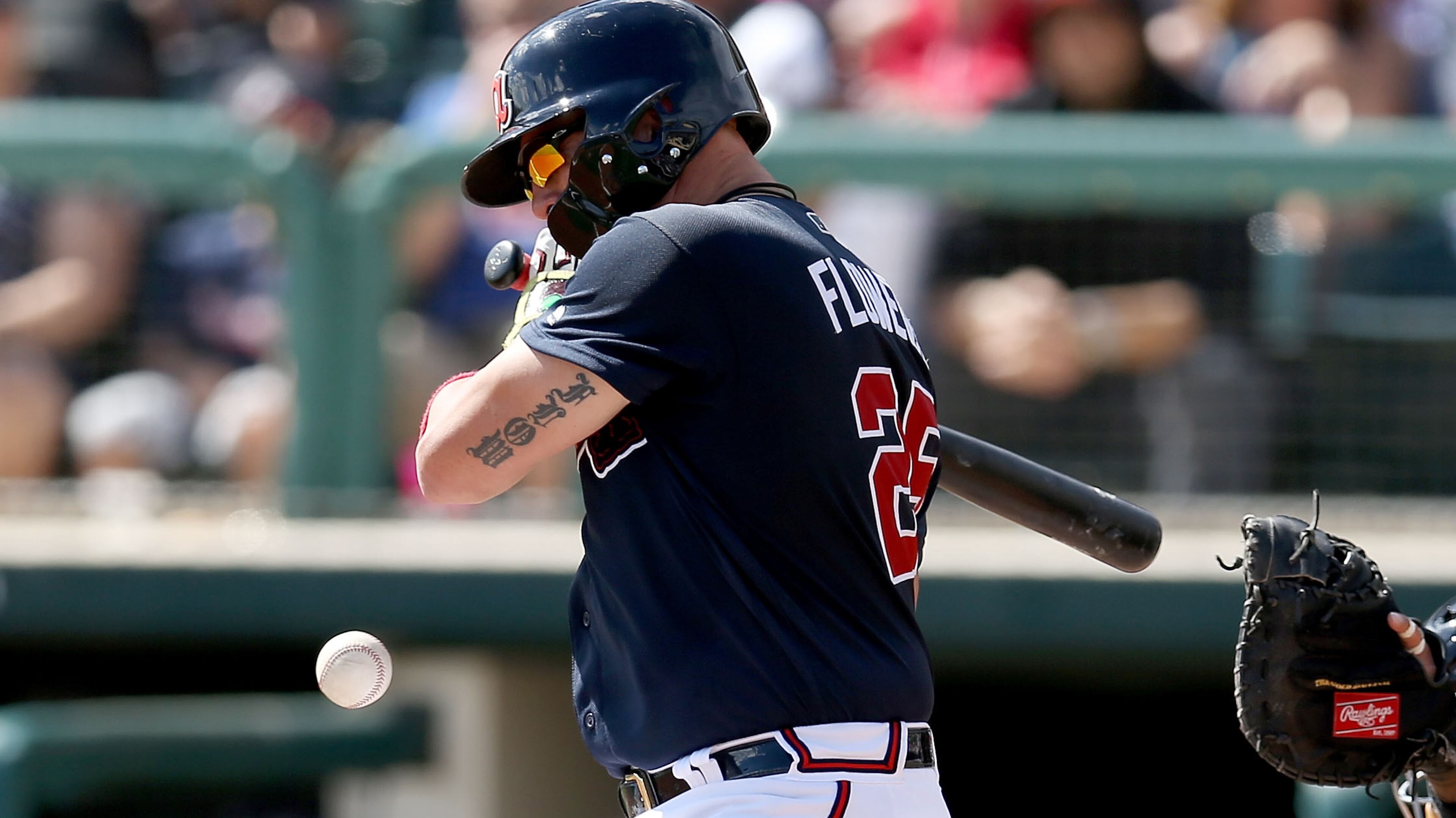 Braves catcher Tyler Flowers is hit by a pitch in the third inning Sunday, March 3, 2019, against the Miami Marlins at Champion Stadium in Lake Buena Vista, Fla.