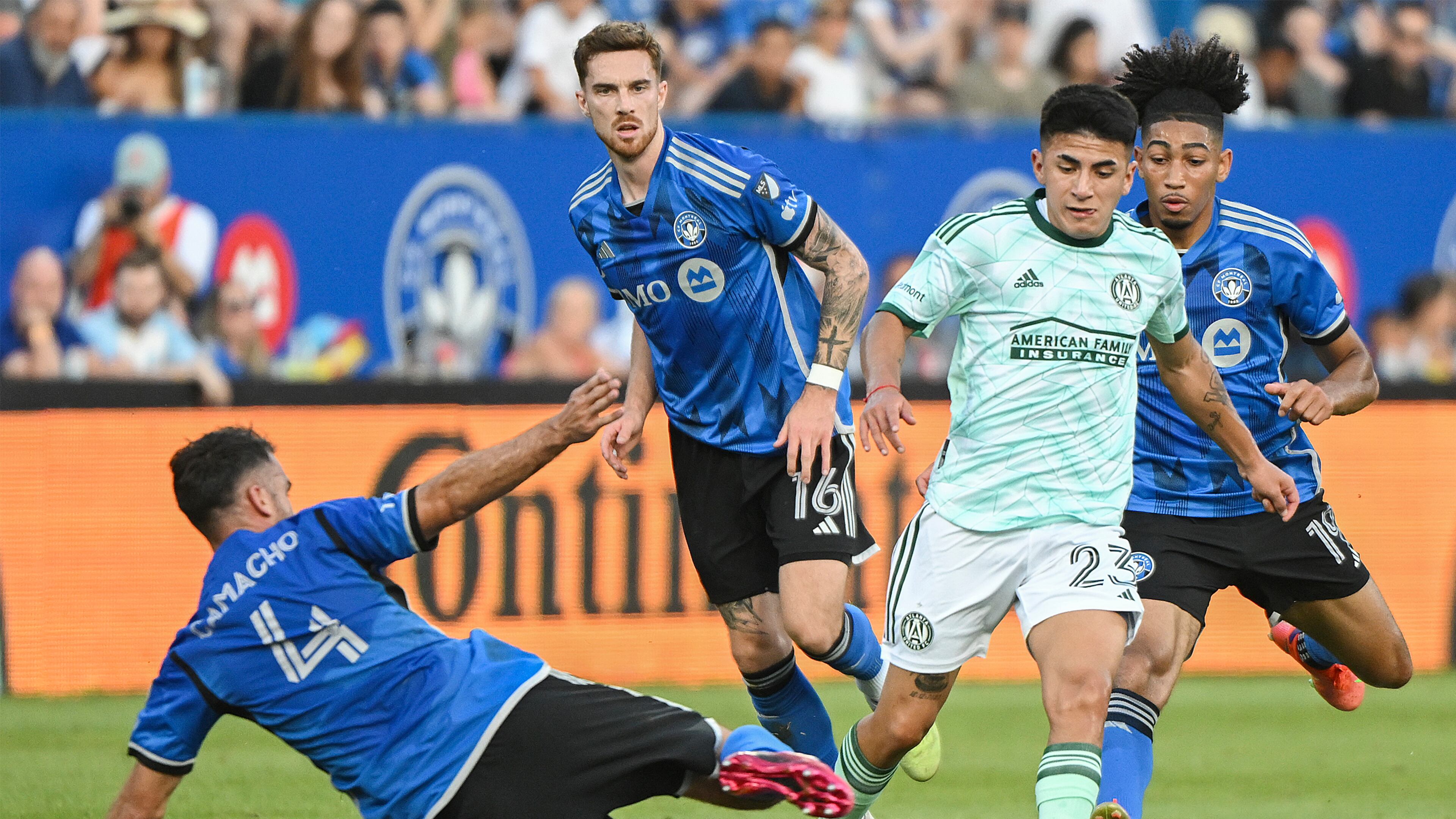 CF Montreal's Rudy Camacho (4) challenges Atlanta United's Thiago Almada (23) during the first half of an MLS soccer match Saturday, July 8, 2023, in Vancouver, British Columbia. (Graham Hughes/The Canadian Press via AP)