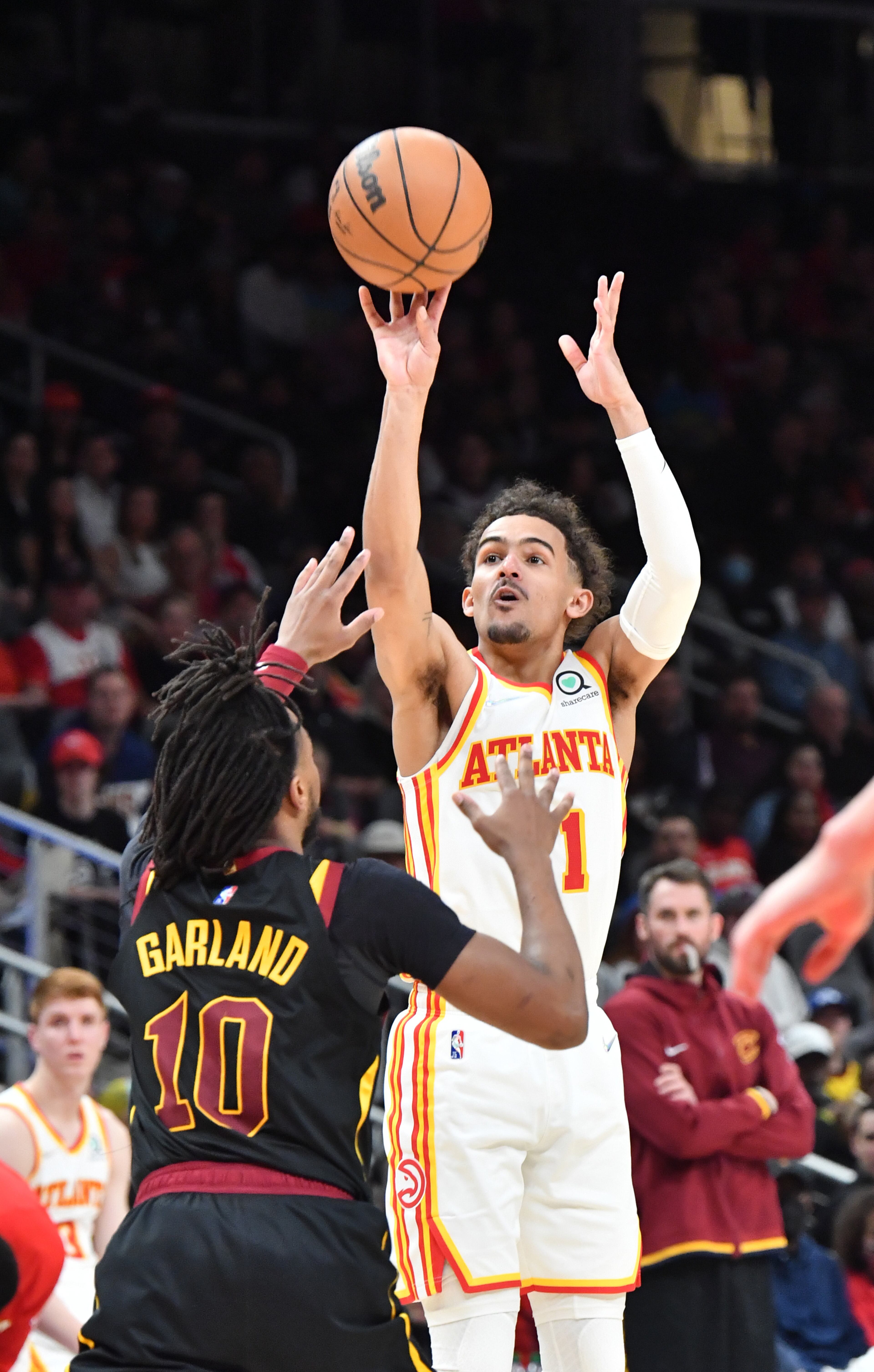 Hawks' guard Trae Young (11) shoots over Cleveland Cavaliers' guard Darius Garland (10) during the first half in an NBA basketball game at State Farm Arena on Thursday, March 31, 2022. Atlanta Hawks won 131-107 over Cleveland Cavaliers. (Hyosub Shin / Hyosub.Shin@ajc.com)