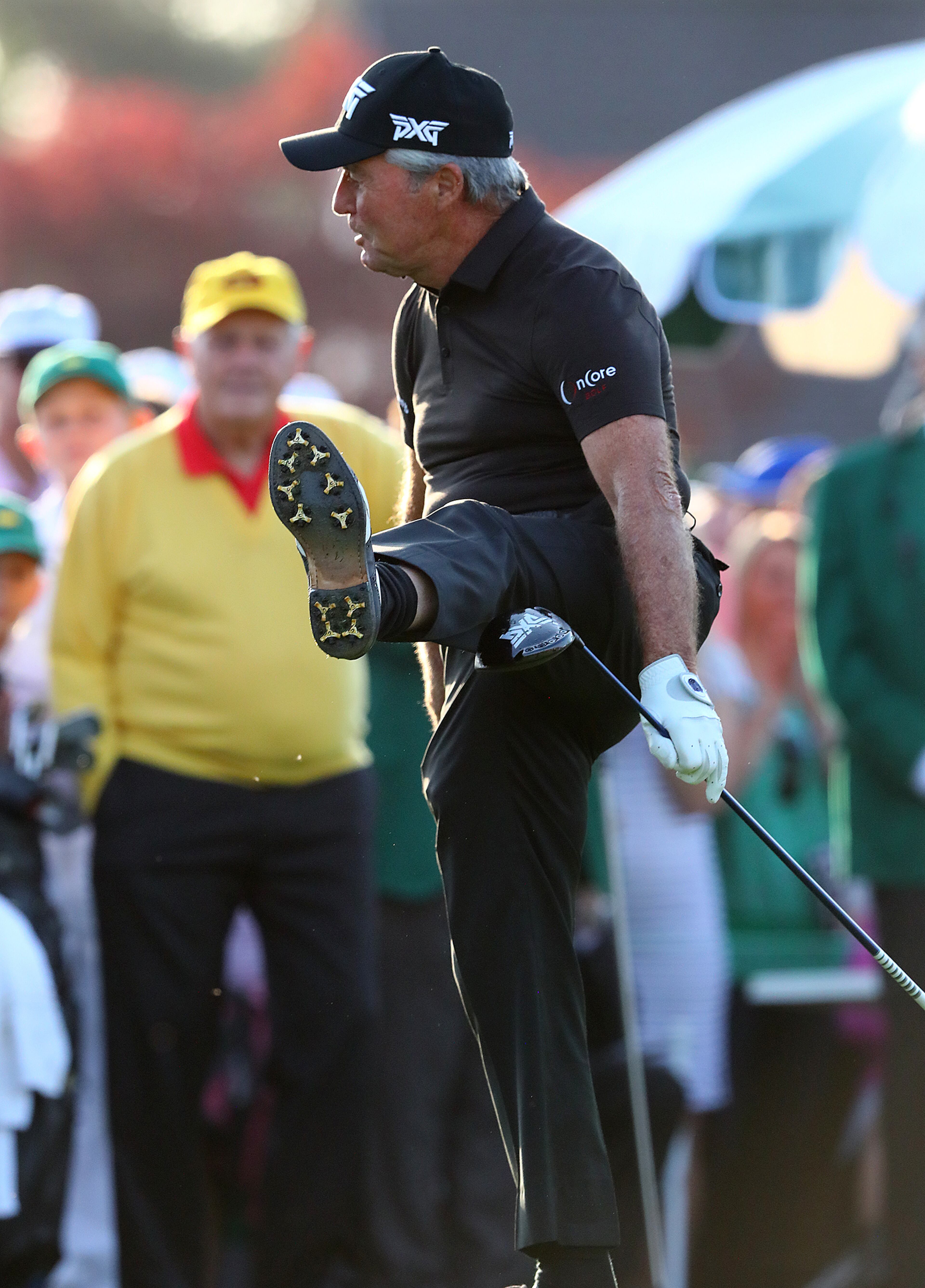 Honorary starter Gary Player kicks his foot in the air after teeing off while Jack Nicklaus looks on to begin the Masters on Thursday, April 11, 2019, in Augusta. Nicklaus is a six time champion and Gary Player is a three time champion. Curtis Compton/ccompton@ajc.com