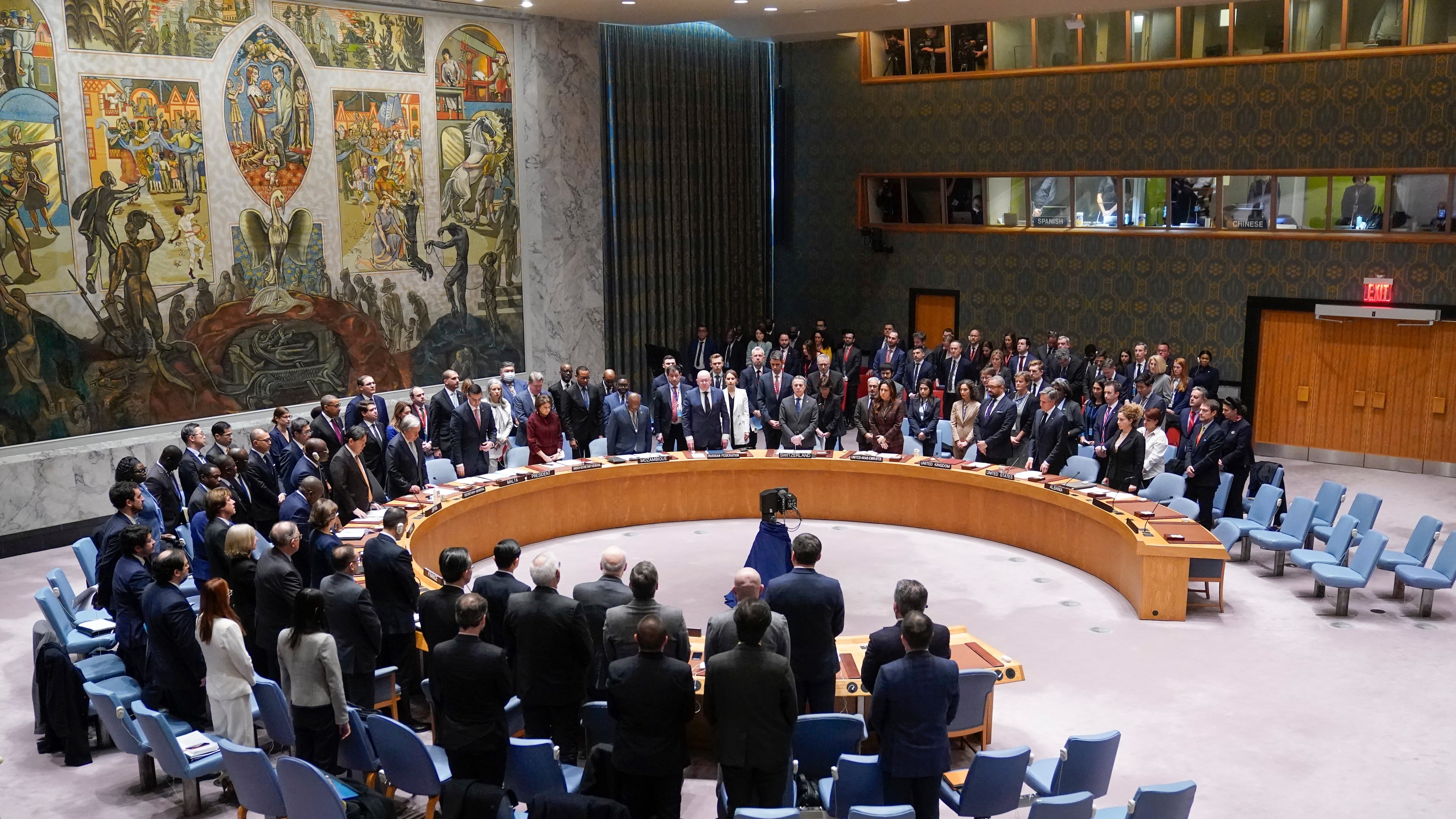 FILE - Participants in a Security Council meeting rise for a moment of silence at United Nations headquarters, Feb. 24, 2023. (AP Photo/Seth Wenig, File)