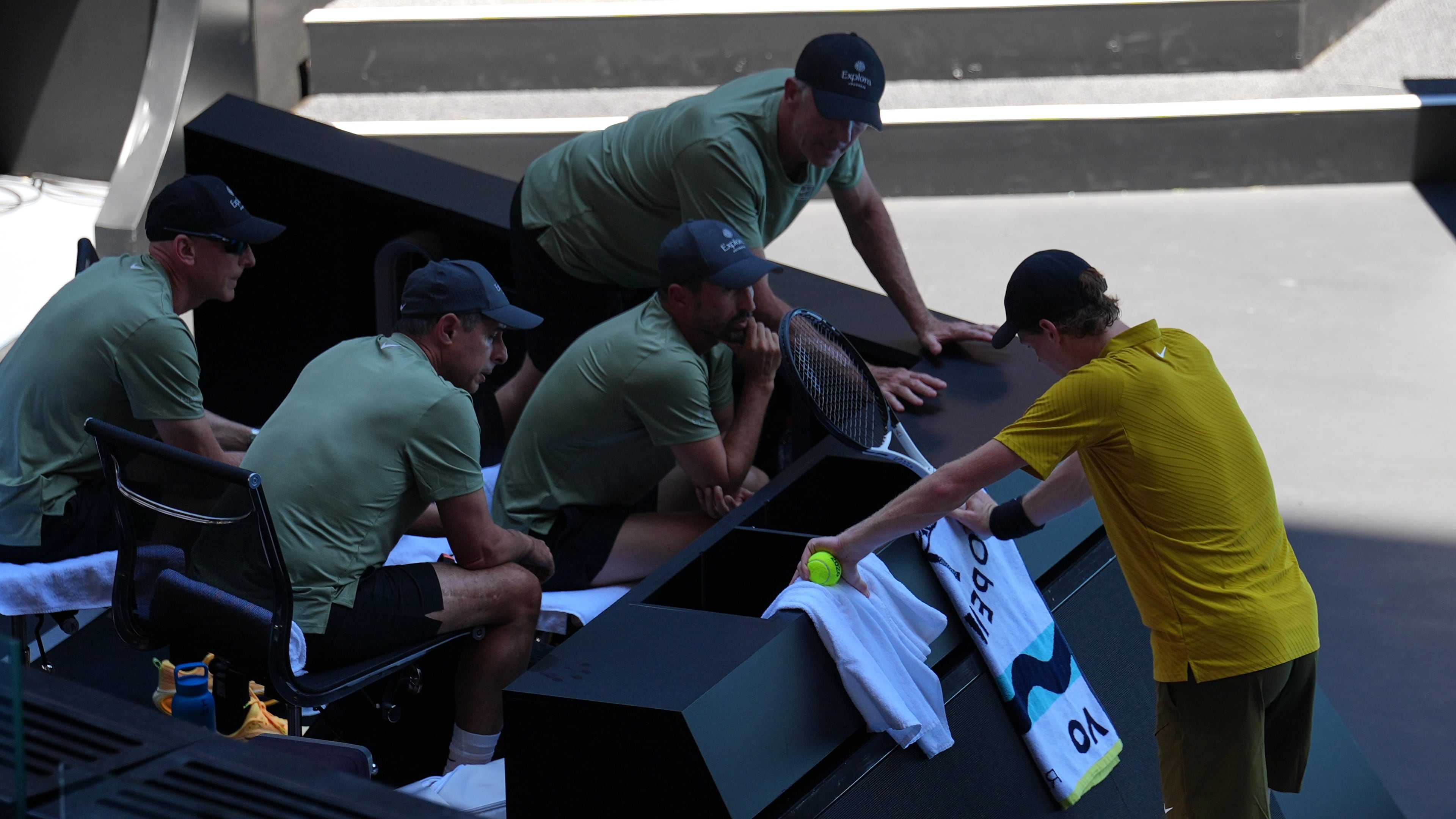 Jannik Sinner of Italy rests at his coaching box during his third round match against Eliot Spizzirri of the U.S. at the Australian Open tennis championship in Melbourne, Australia, Saturday, Jan. 24, 2026. (AP Photo/Dita Alangkara)