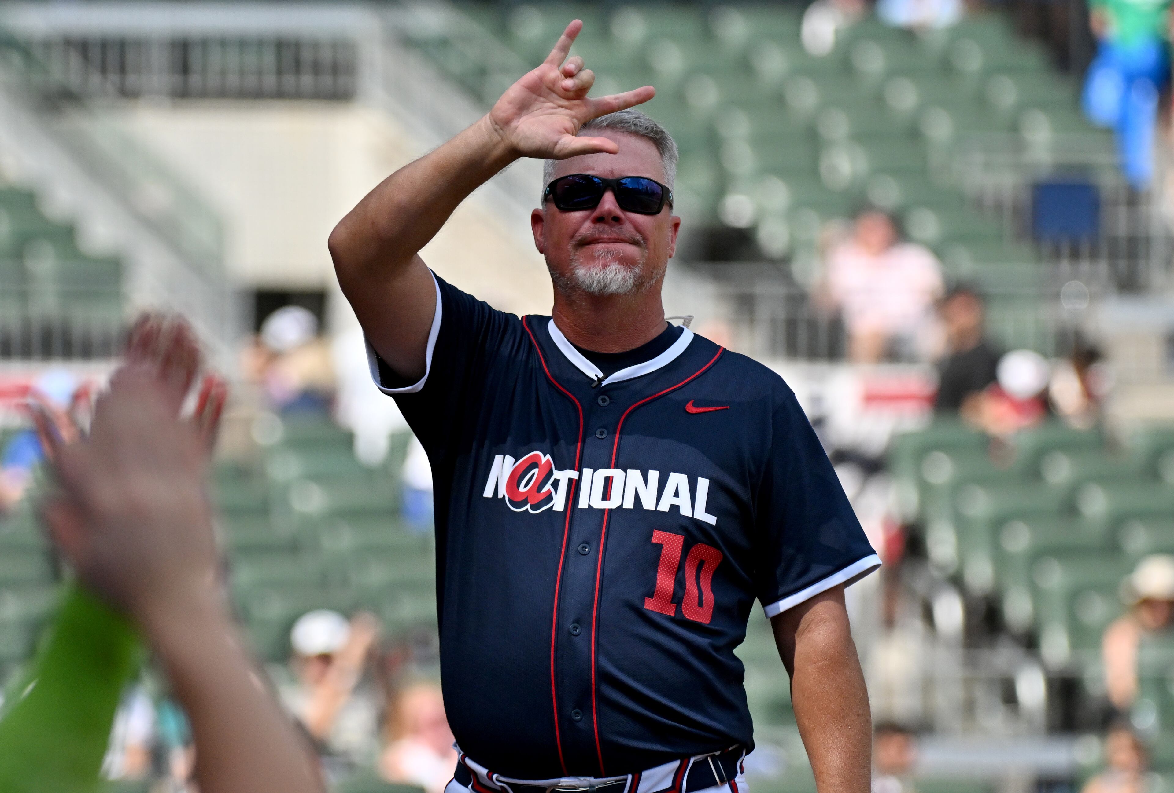 National League manager Chipper Jones waves to fans as he is recognized during the All-Star Futures Game at Truist Park, Saturday, July 12, 2025, in Atlanta. National League won 4-2 over American League. (Hyosub Shin / AJC)