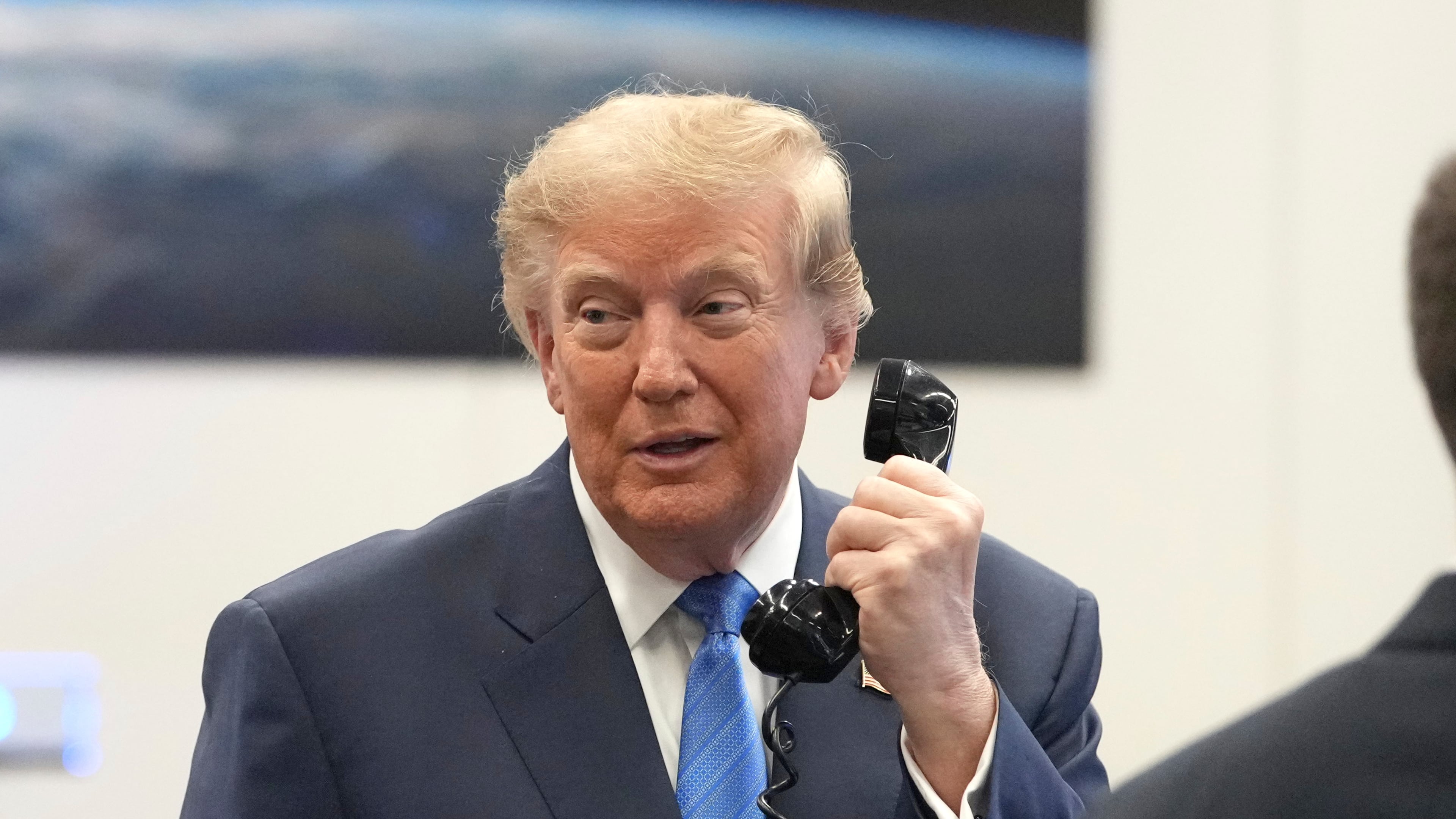 President Donald Trump speaks to astronauts aboard the International Space Station, Friday, Aug. 28, 2026, at Johnson Space Center's Mission Control Center in Houston. (AP Photo/Mark Schiefelbein)