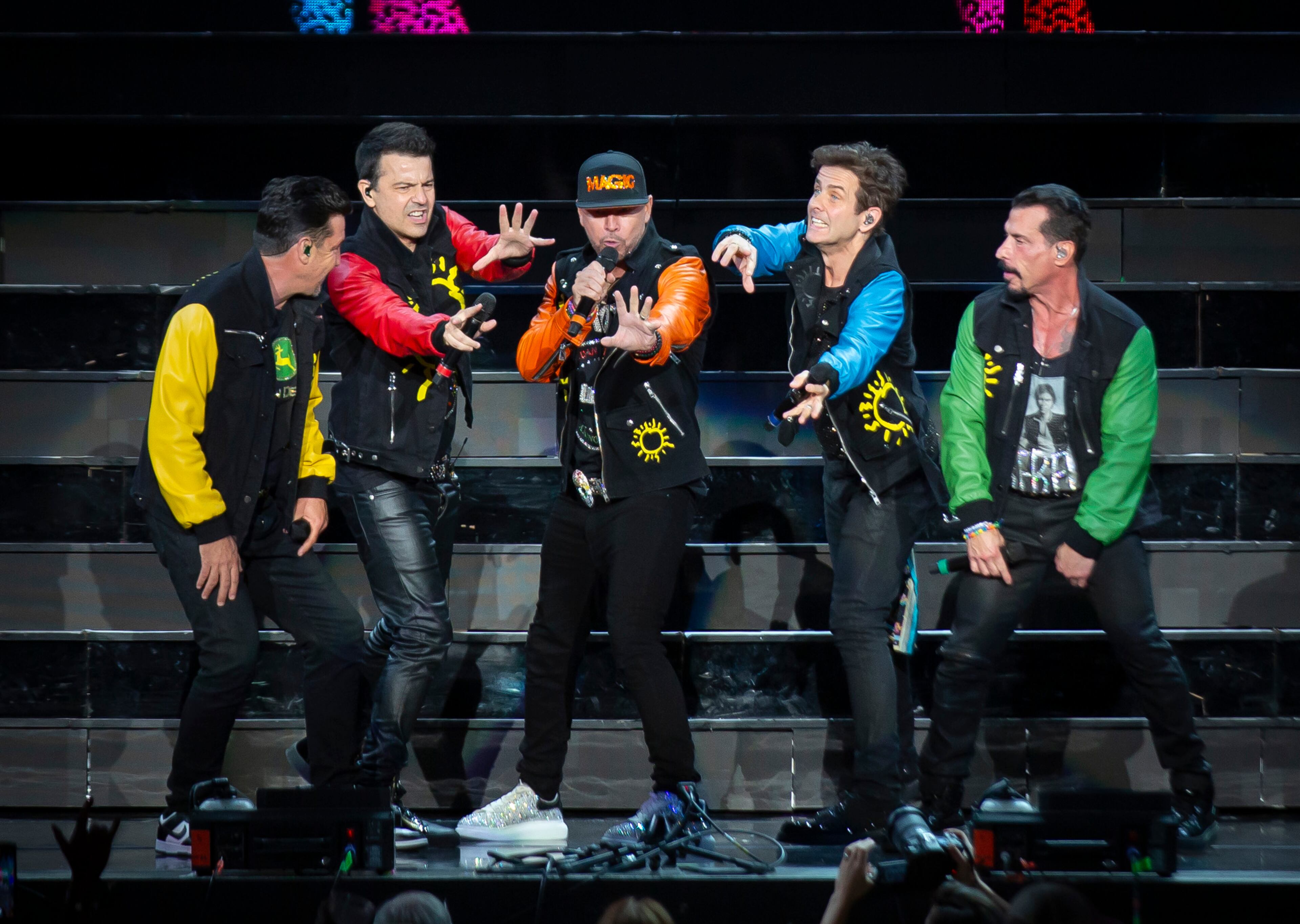 New Kids on the Block cranked out the hits to a packed house of neon clad fans at Ameris Bank Amphitheatre in Alpharetta on Friday, July 26, 2024. (RYAN FLEISHER FOR THE ATLANTA JOURNAL-CONSTITUTION)