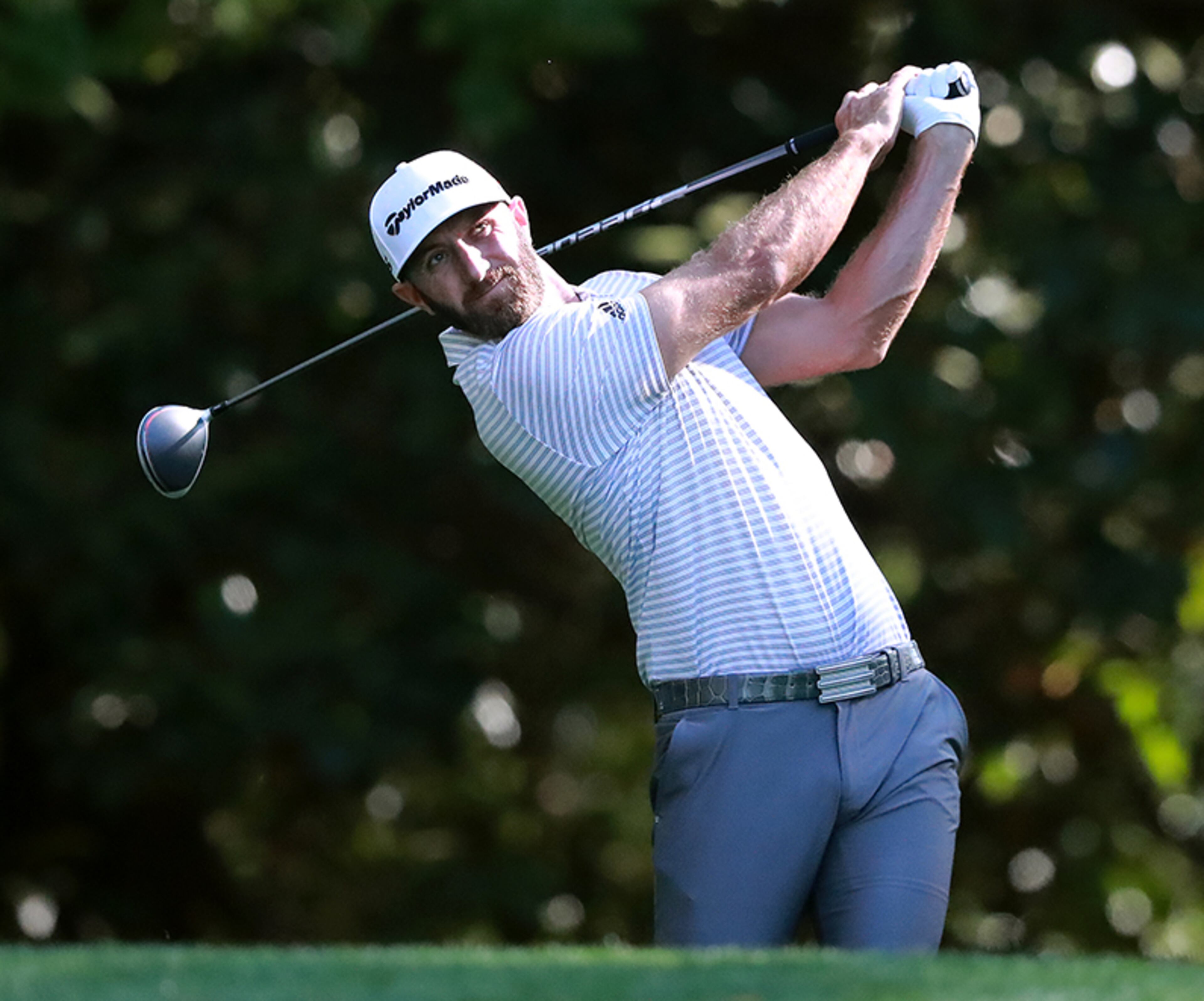Dustin Johnson tees off on the 11th hole during his practice round Wednesday, April 10, 2019, for the Masters at Augusta National Golf Club in Augusta.