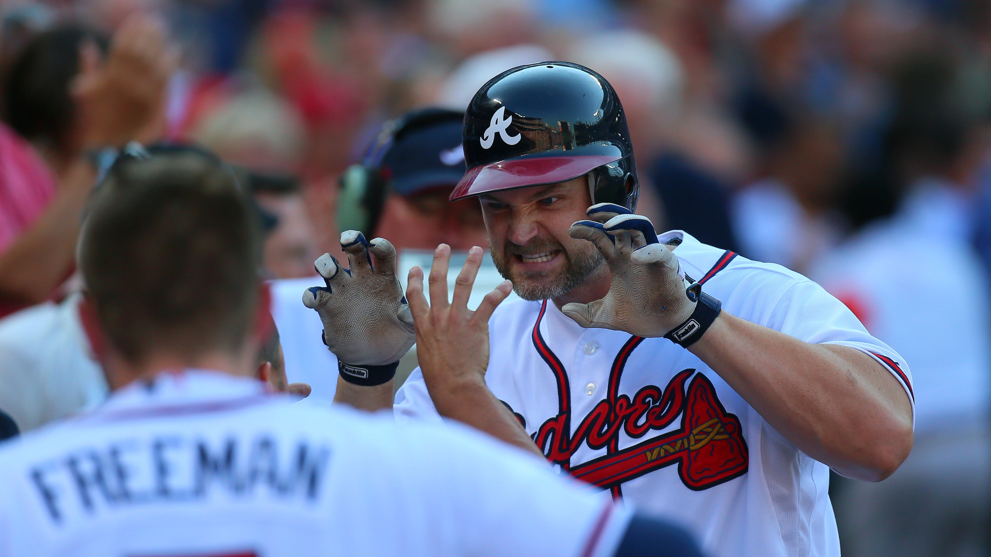 David Ross, right, played four seasons for the Braves, from 2009 to 2012. CURTIS COMPTON / CCOMPTON@AJC.COM