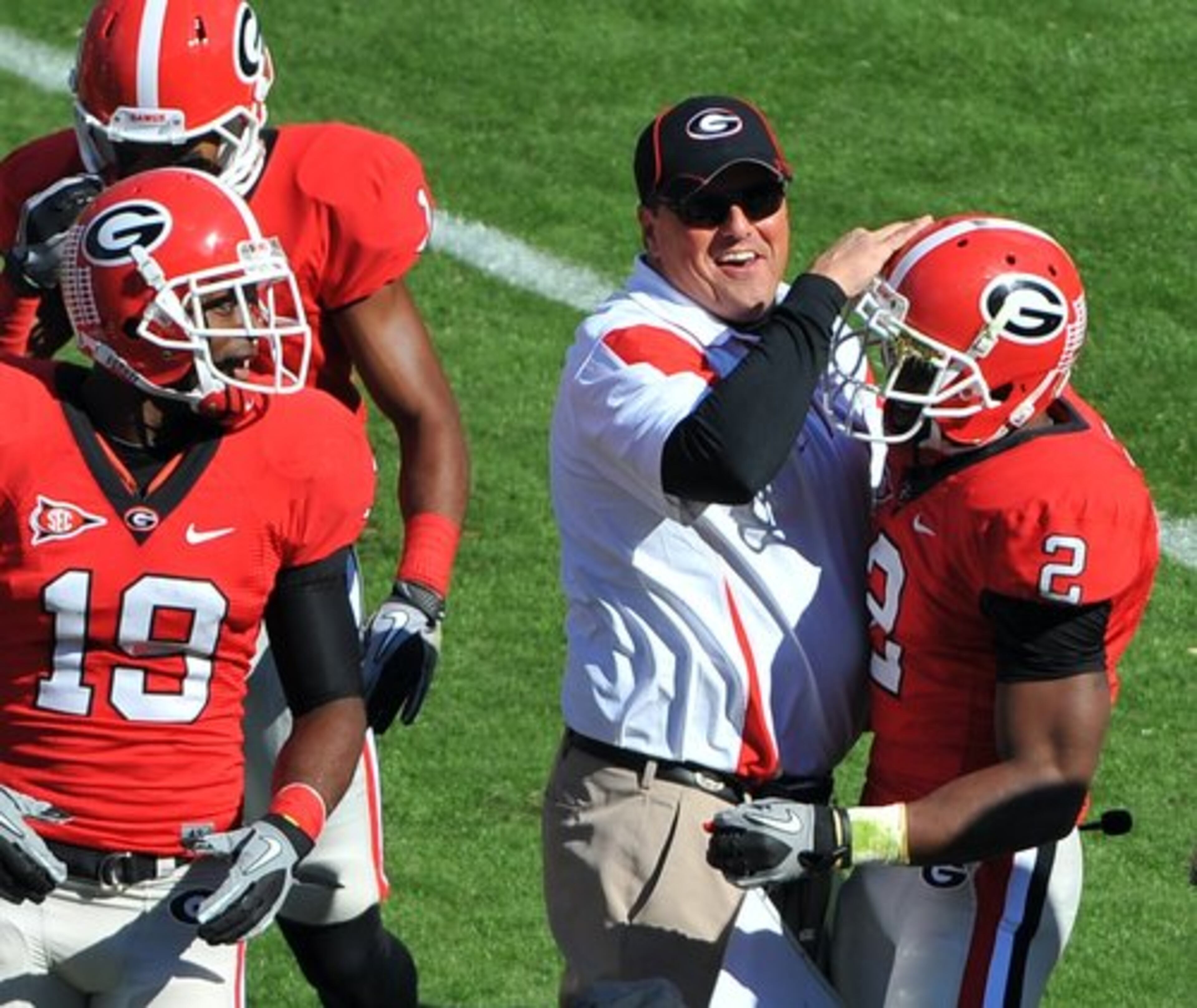 UGA defensive coordinator Todd Grantham celebrates with Brandon Boykin following an interception.