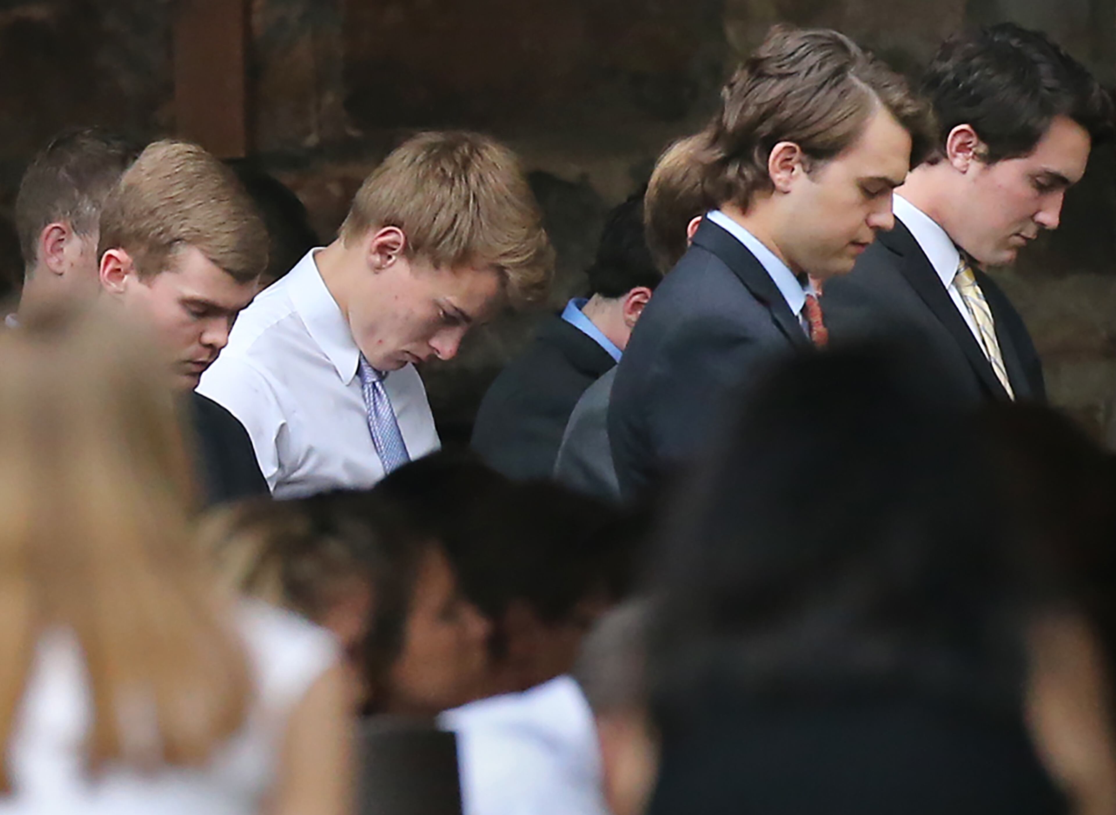 The overflow crowd bows for the opening prayer during the Christina Semeria funeral "Remembering & Celebrating the life of Christina" at Birmingham United Methodist Church on Monday, May 2, 2016, in Milton. The UGA student will be remembered for her kindness and selflessness, her friends and family said. Curtis Compton / ccompton@ajc.com