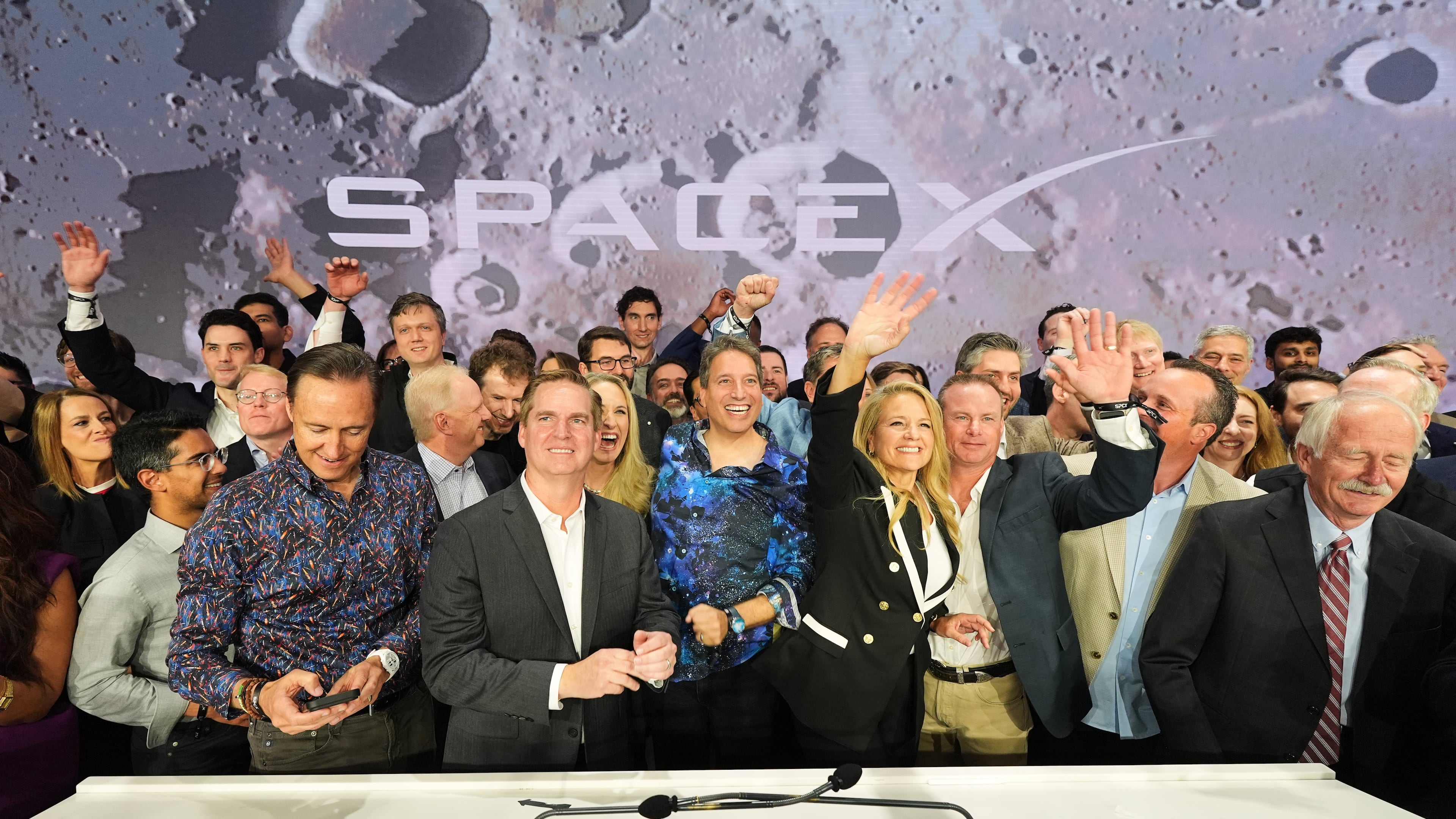 Gwynne Shotwell, President and COO of SpaceX, third from right, celebrates with colleagues during a bell ringing ceremony for the IPO of SpaceX at the Nasdaq MarketSite in New York, Friday, June 12, 2026, in New York. (AP Photo/Frank Franklin II)