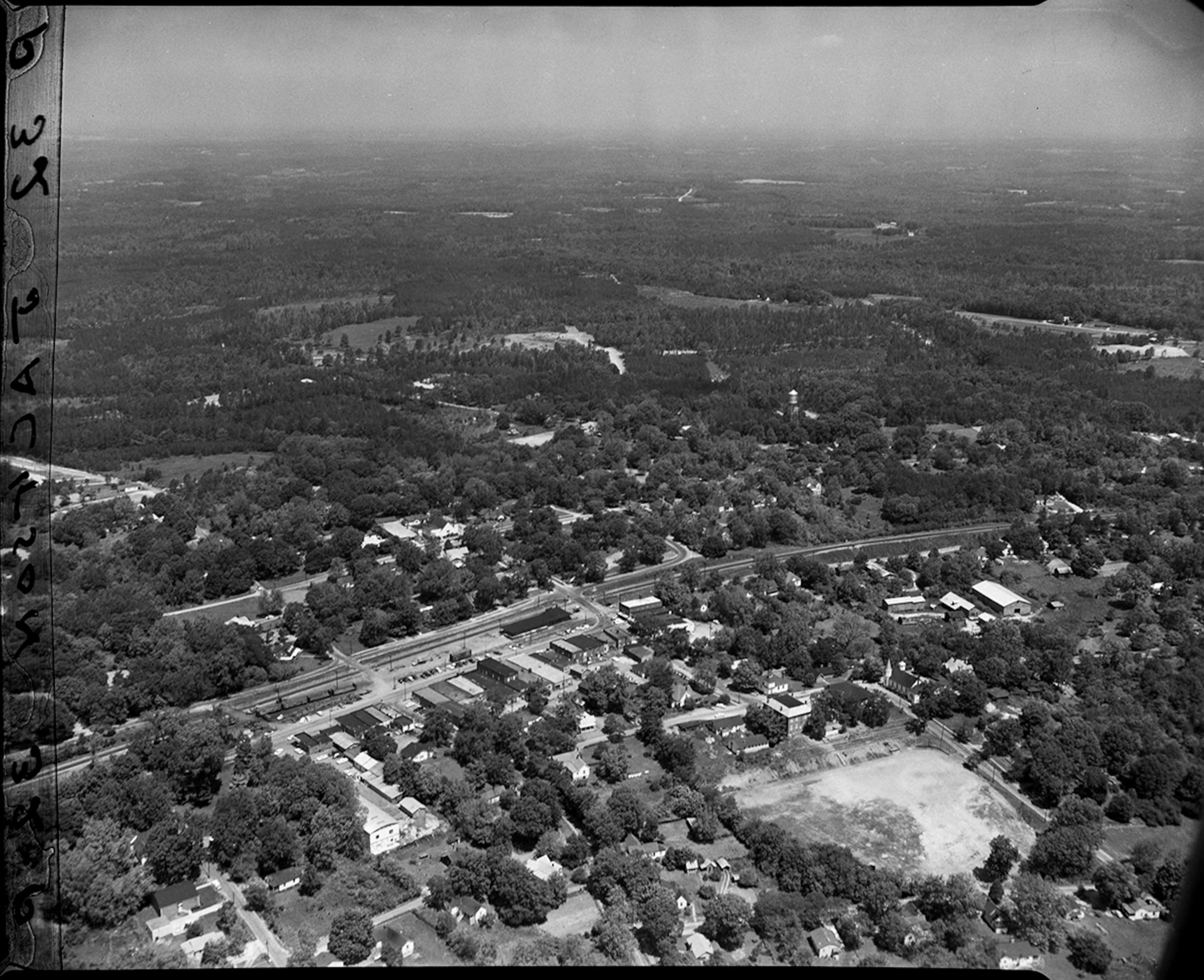The early years of Norcross are woven tightly with Atlanta's. Norcross was founded in 1870 by John Thrasher, the same pioneer entrepreneur who created Atlanta's first settlement of Thrasherville. Thrasher named the new Gwinnett town after his friend Jonathan Norcross, who was one of Atlanta's first mayors. This aerial photo of Norcross is from 1960. (Lane Brothers Commercial Photographers Collection, GSU Library, LBGPOA4-014c)
