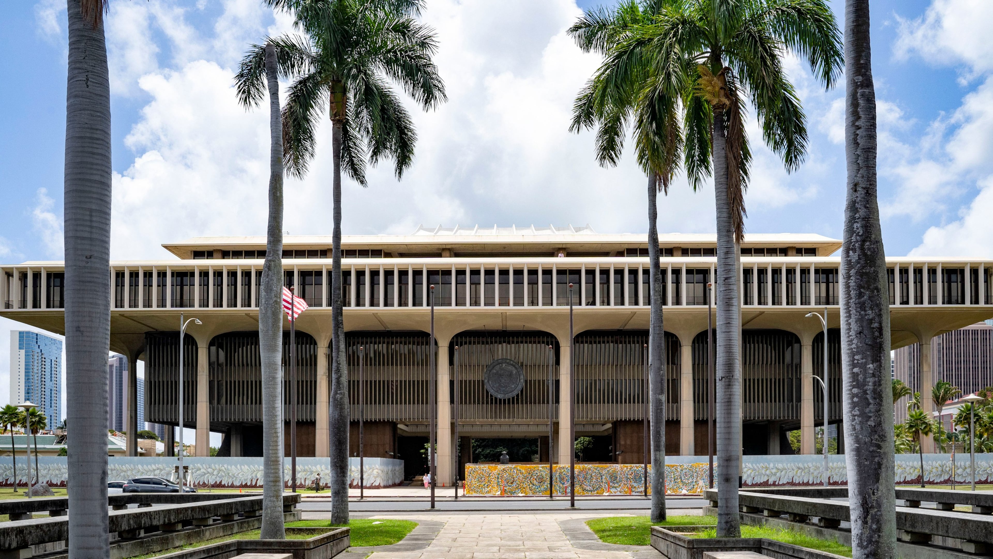FILE - Palm trees frame the Hawaii State Capitol, April 23, 2025, in Honolulu, Hawaii. (AP Photo/Mengshin Lin, File)