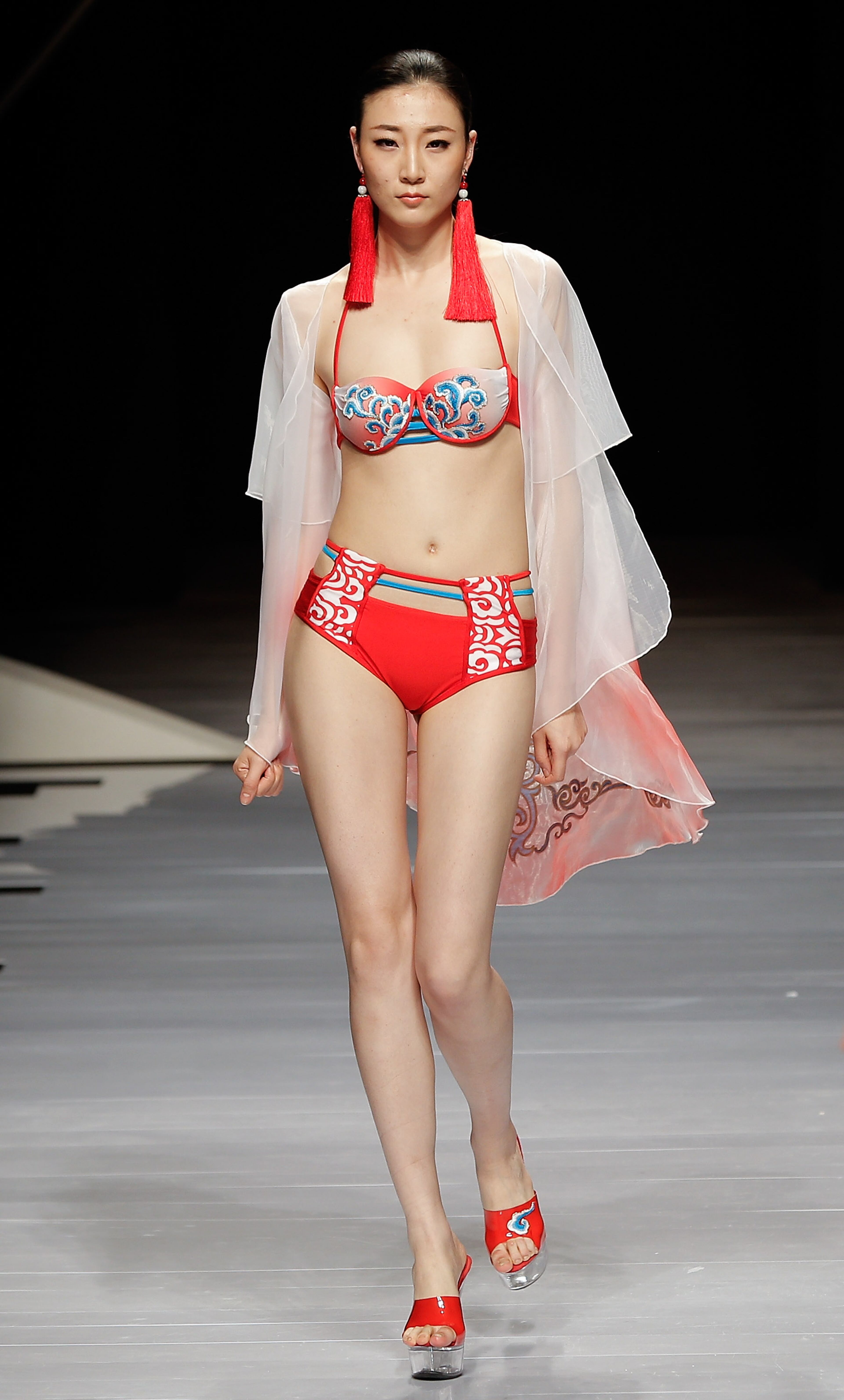 BEIJING, CHINA - MARCH 28: A model showcases designs on the catwalk during the 2015 Hosa Swimming Fashion Trend Show of Mercedes-Benz China Fashion Week Autumn/Winter 2014/2015 at the Banquet Hall, Beijing Hotel on March 28, 2014 in Beijing, China. (Photo by Lintao Zhang/Getty Images)