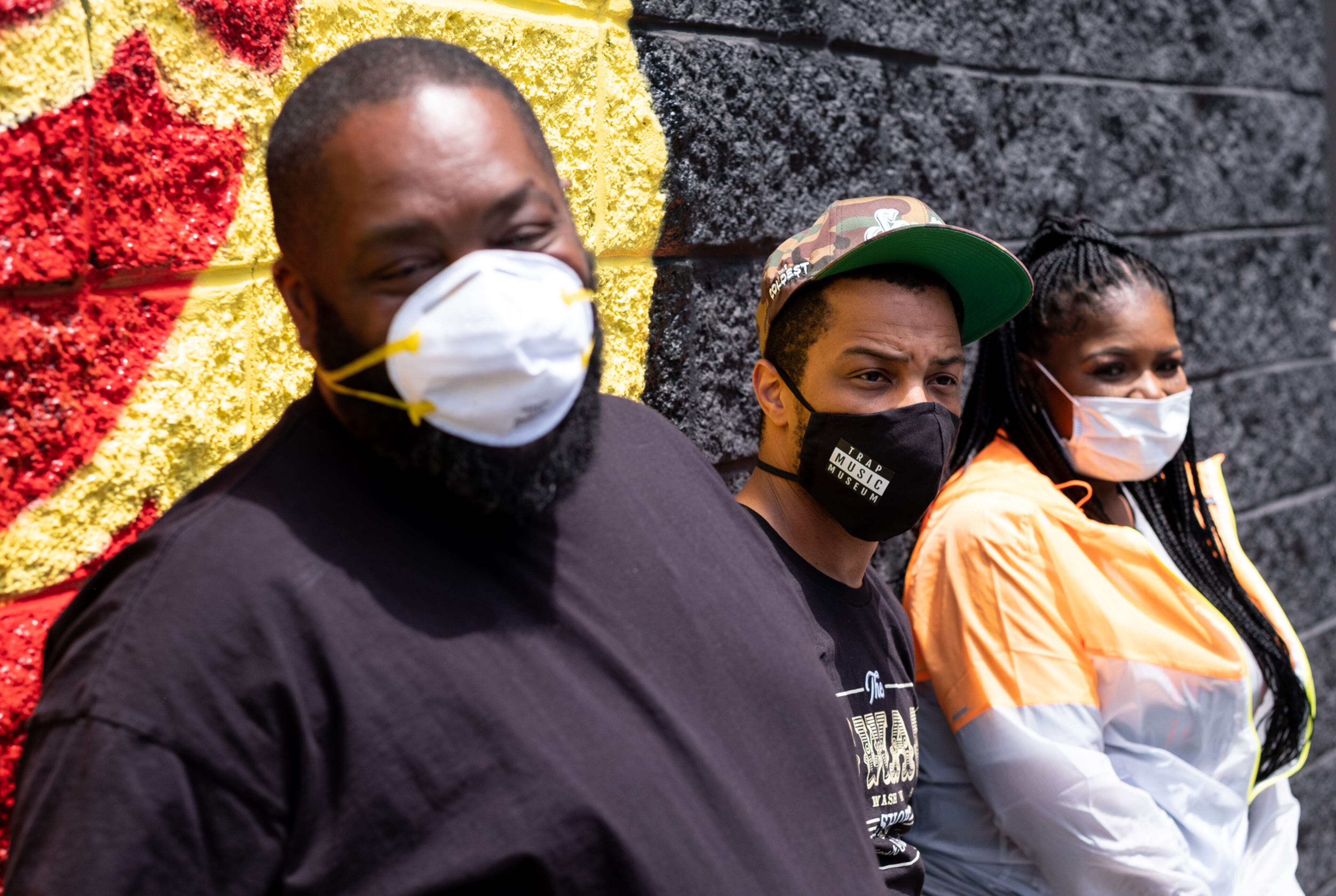 200506-Atlanta- Niya Woods reacts as T.I. walks up her driveway to surprise her with hygiene supplies and $500 Wednesday afternoon May 6, 2020. T.I. and Killer Mike made the surprise deliveries and shared the news that two-weeks of groceries were on the way to five families served by PAWkids, a childrenâs enrichment program. Ben@BenGray.com for the Atlanta Journal Constitution