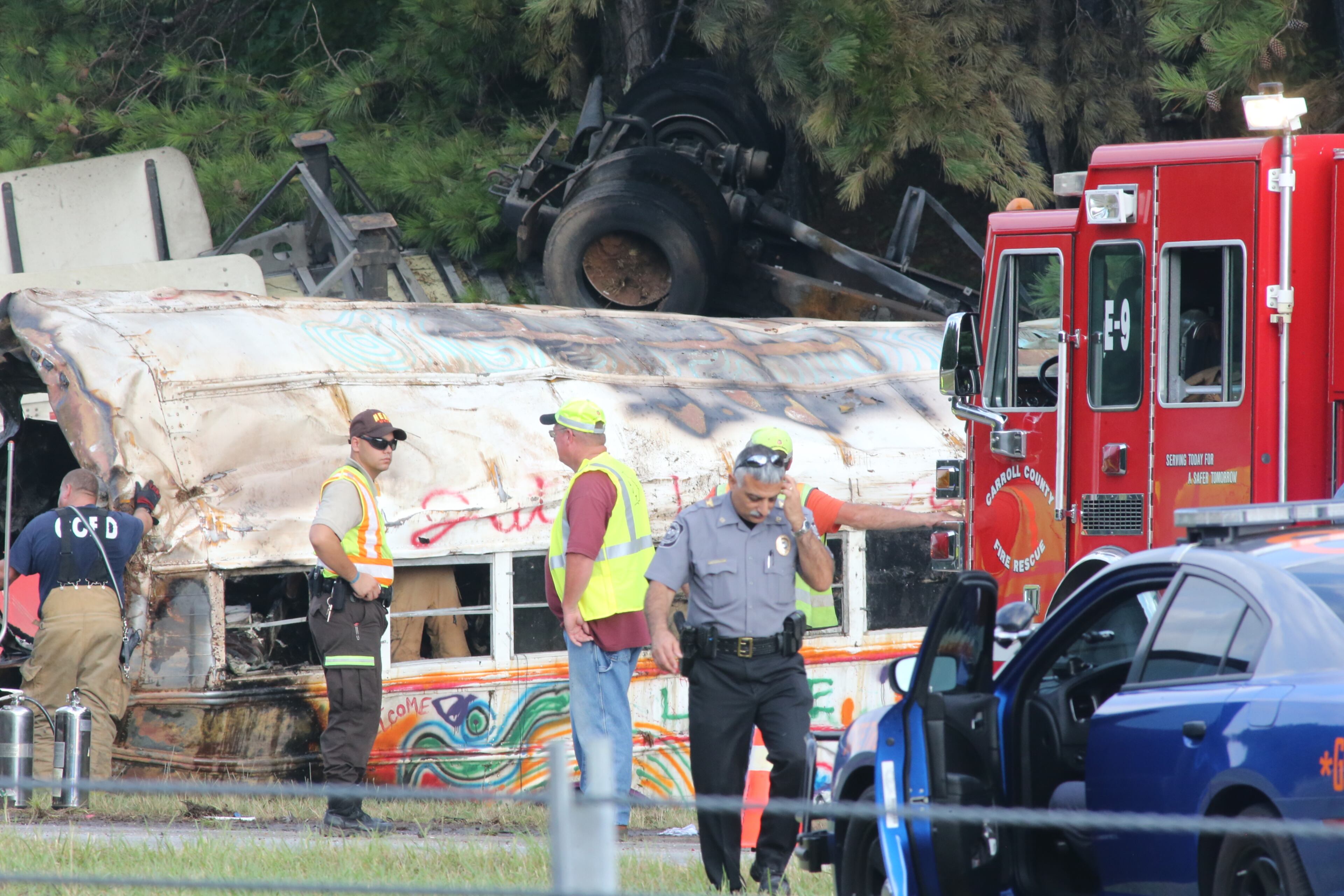 All westbound lanes of I-20 in west Georgia were shut down for about three hours Wednesday morning because of a fiery wreck involving a tractor-trailer and a bus, but one lane has now reopened. JOHN SPINK/JSPINK@AJC.COM