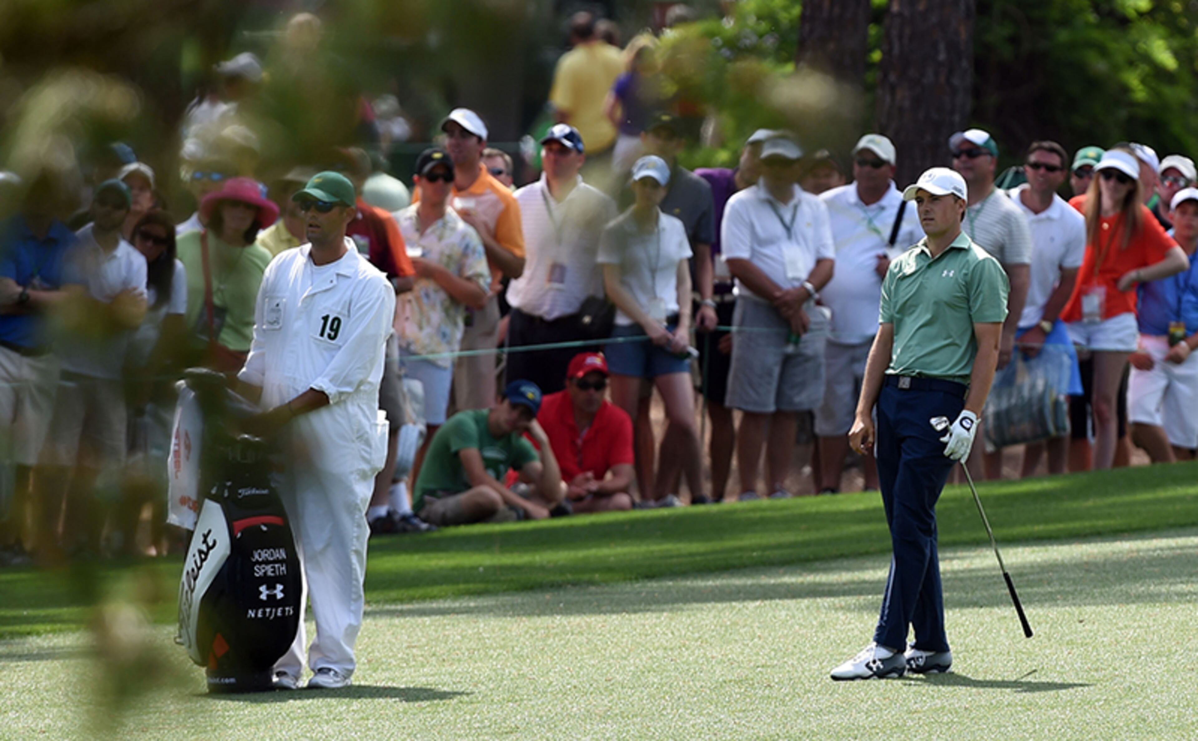 Jordan Spieth looks at his approach shot on No. 7 during the final round of the Masters Tournament Sunday, April 13, 2014, at Augusta National Golf Club.
