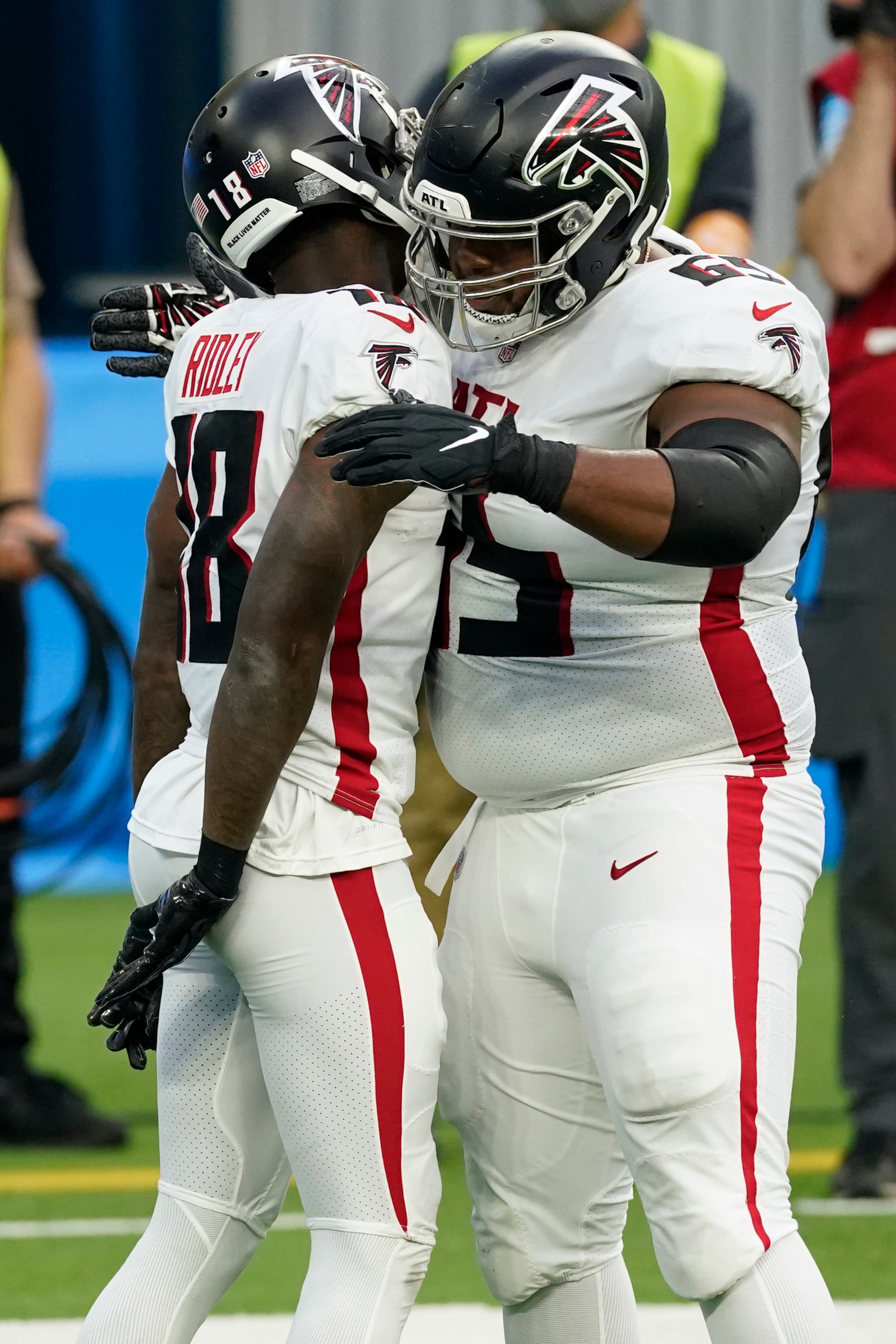 Atlanta Falcons wide receiver Calvin Ridley (18) celebrates his touchdown catch with Justin McCray during the first half against the Los Angeles Chargers Sunday, Dec. 13, 2020, in Inglewood, Calif. (Ashley Landis/AP)