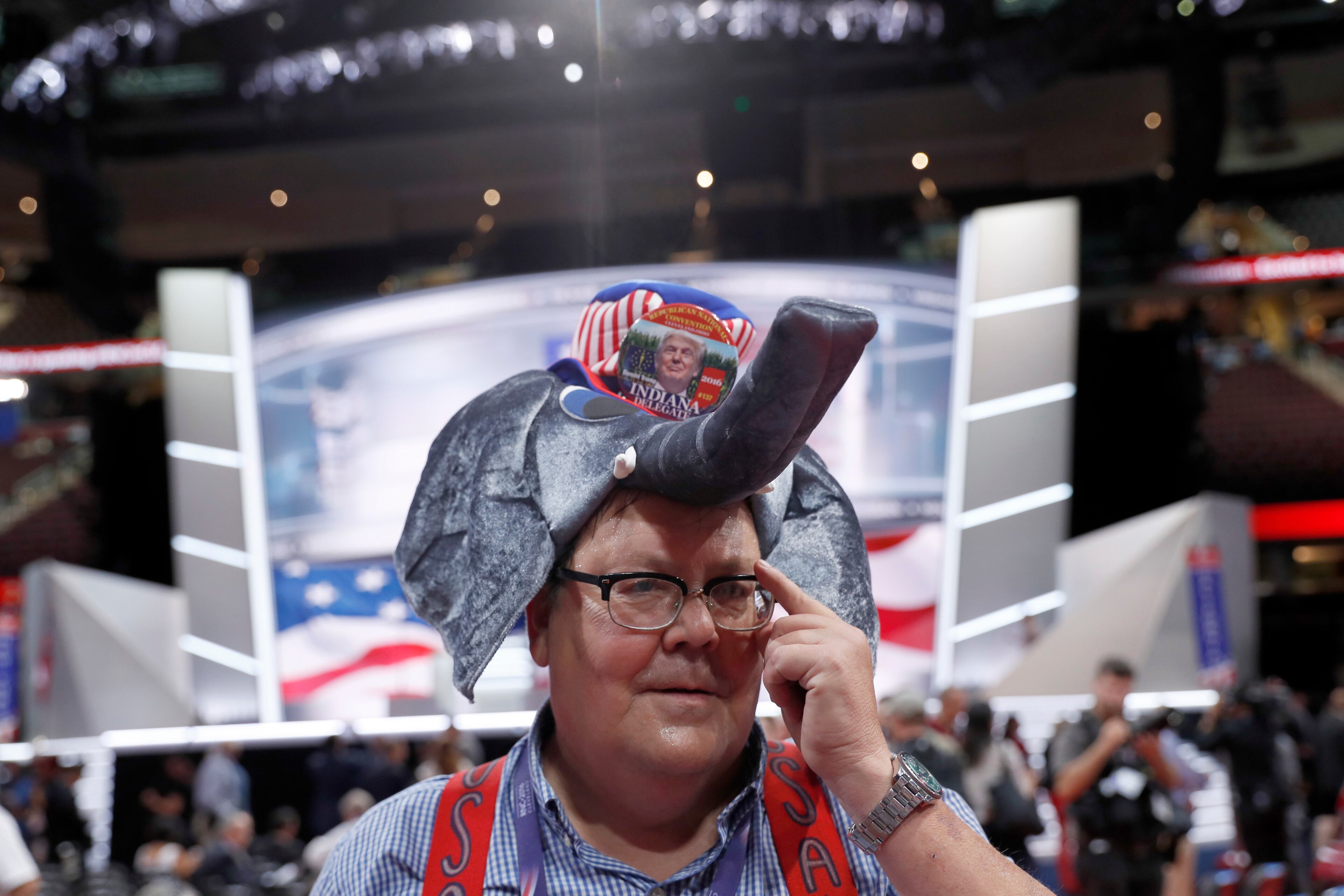 Monday: Indiana delegate William Springer wears an elephant hat with Trump button as he walks around the convention floor before the evening session of the first day of the Republican National Convention in Cleveland, Monday, July 18, 2016. (AP Photo/Carolyn Kaster)