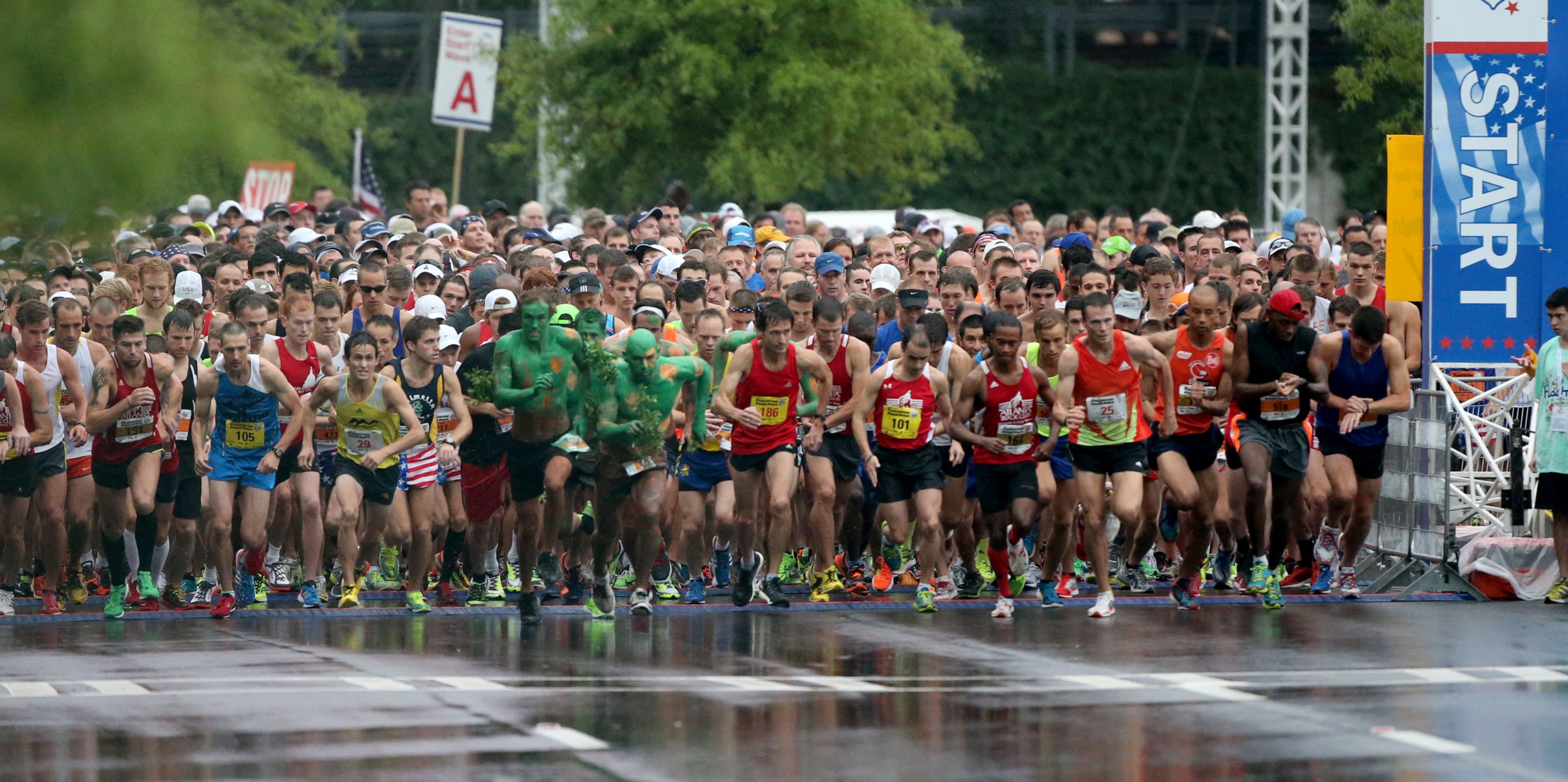 The start of the 44th running of the AJC Peachtree Road Race at Lenox Square Thursday morning in Atlanta, Ga., July 4, 2013. JASON GETZ / JGETZ@AJC.COM
