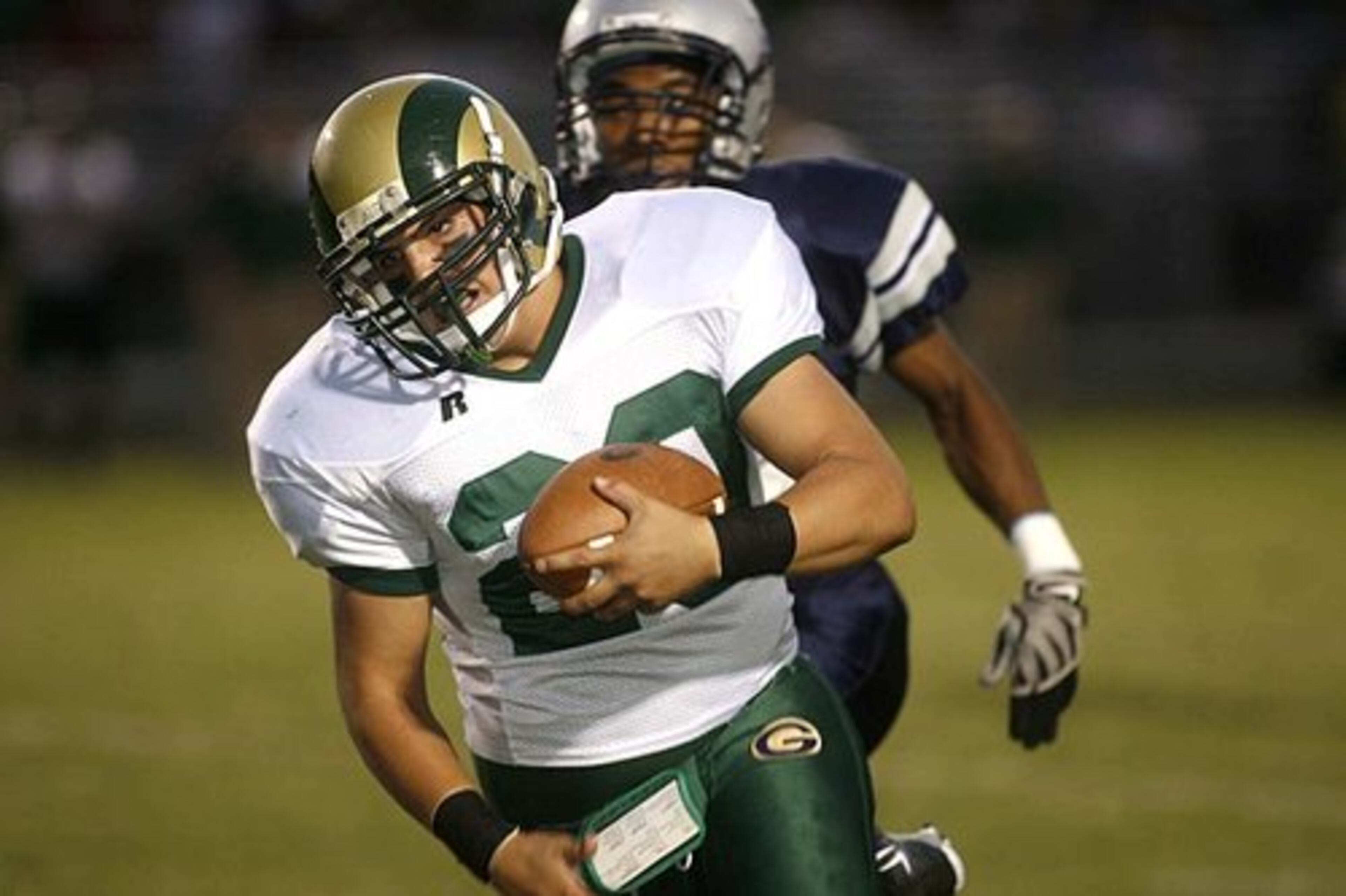 Grayson's Nick Benzor (20) breaks away from a Comets defender.