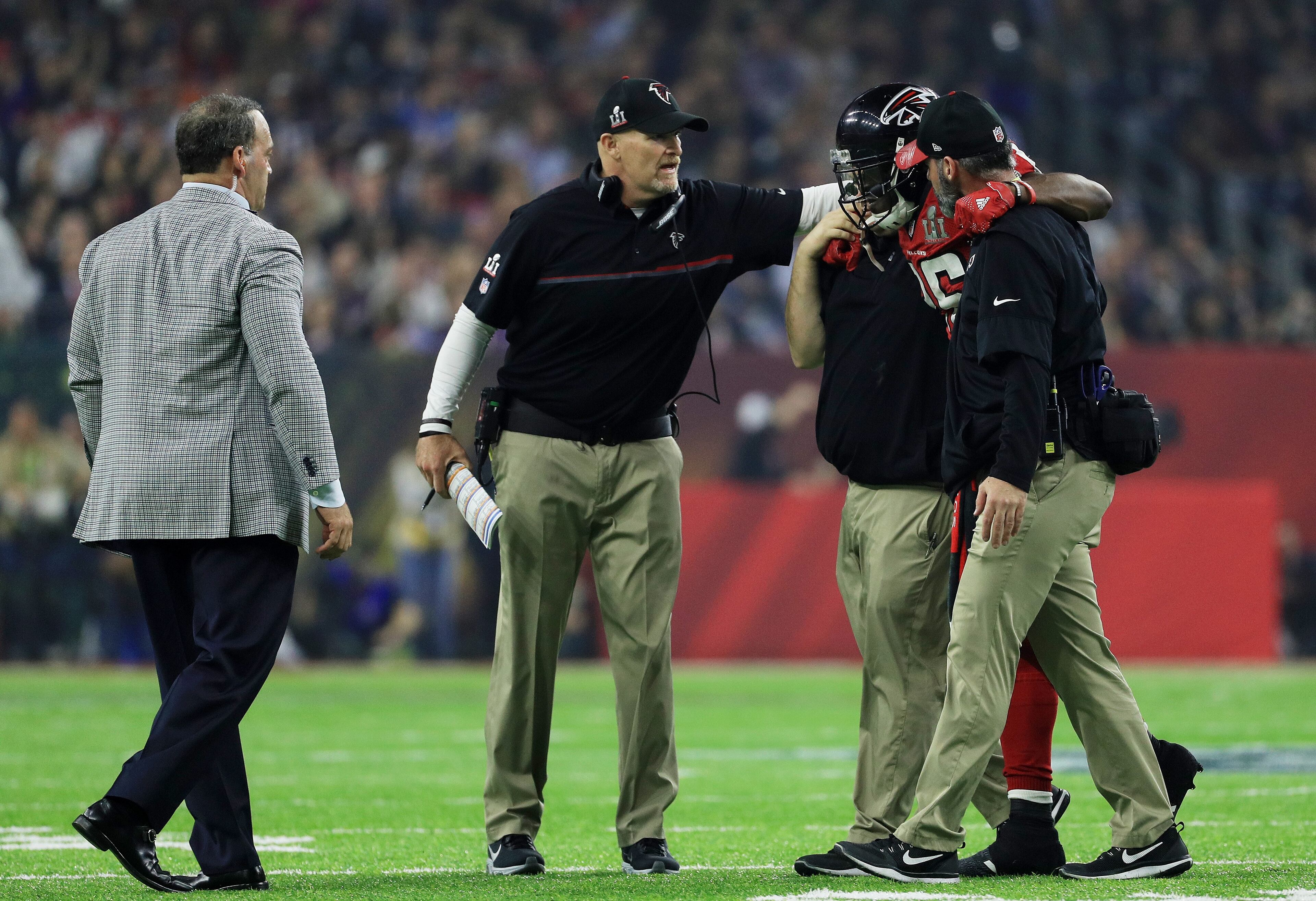 HOUSTON, TX - FEBRUARY 05: Head coach Dan Quinn of the Atlanta Falcons watches Tevin Coleman #26 is helped off the field during Super Bowl 51 at NRG Stadium on February 5, 2017 in Houston, Texas. (Photo by Mike Ehrmann/Getty Images)