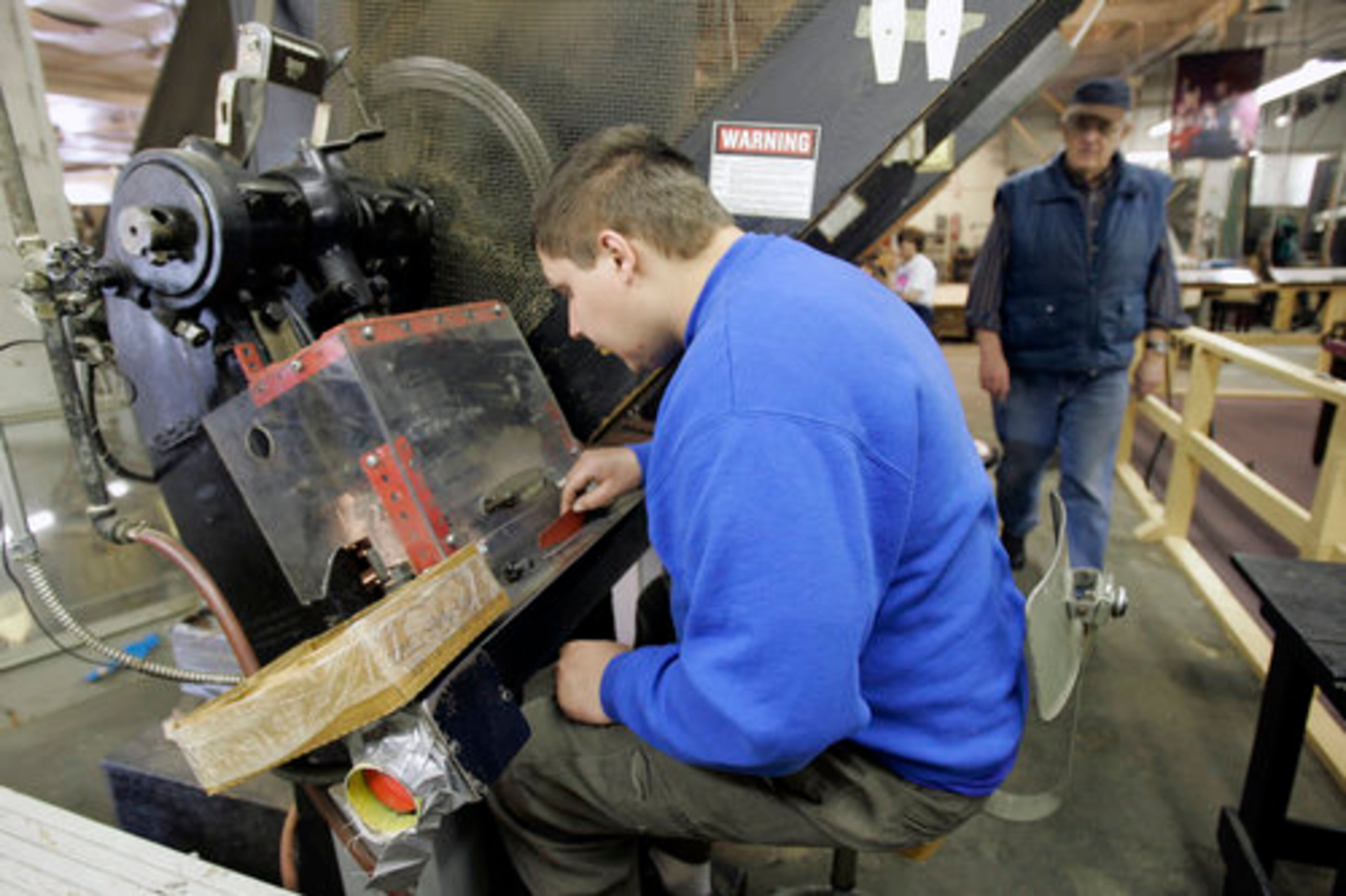 Rick Preischel makes kazoos on Main Street in a farm town southwest of Buffalo known as much for its yearly corn festival as kazoos.