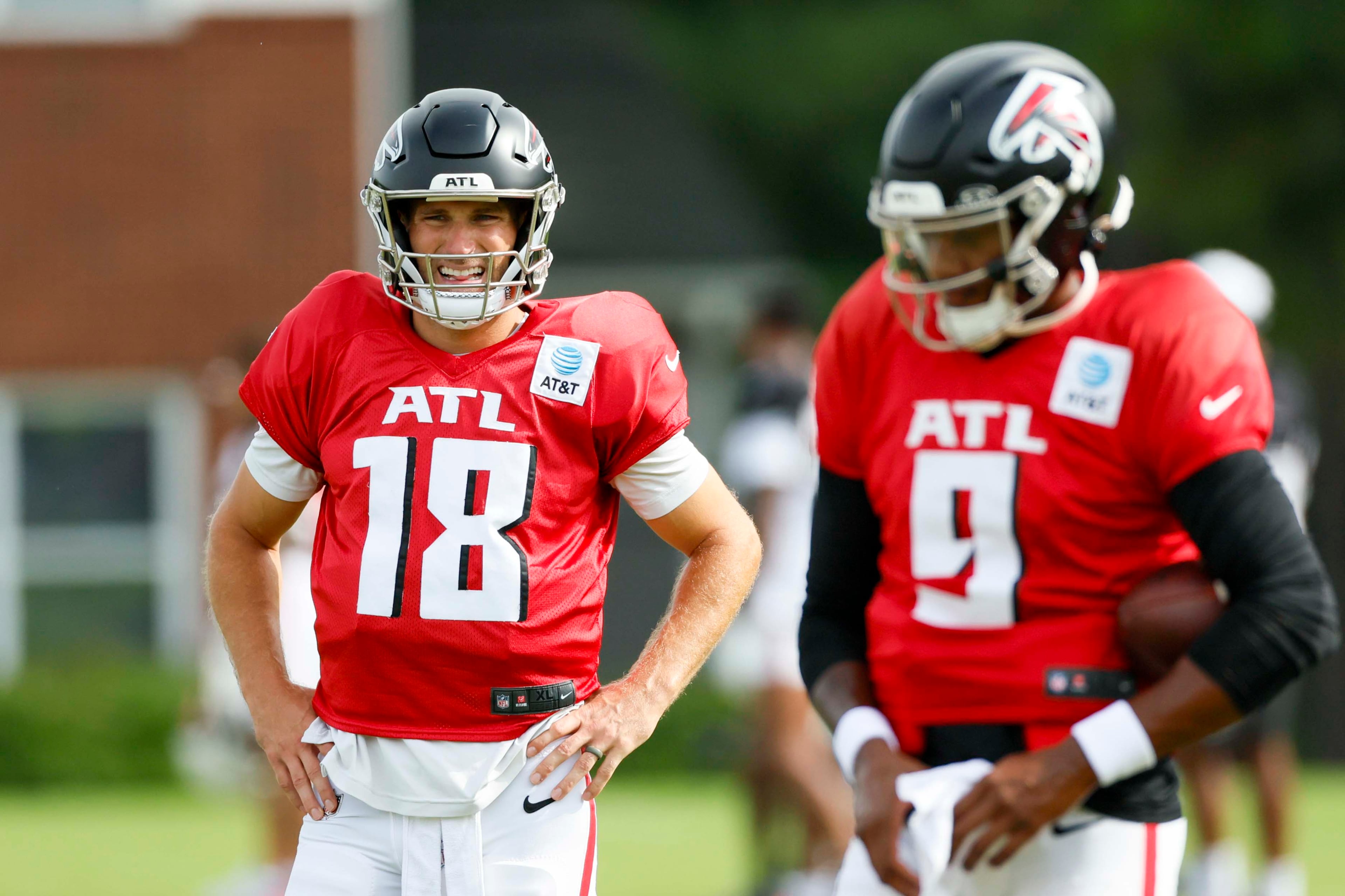 Falcons quarterbacks Kirk Cousins (left) and Michael Penix Jr. attend a joint practice with the Tennessee Titans last summer. Penix was the starter before he suffered a season-ending knee injury on Nov. 16, leading to Cousins taking the reins for the remainder of the season. (Miguel Martinez/AJC 2025)