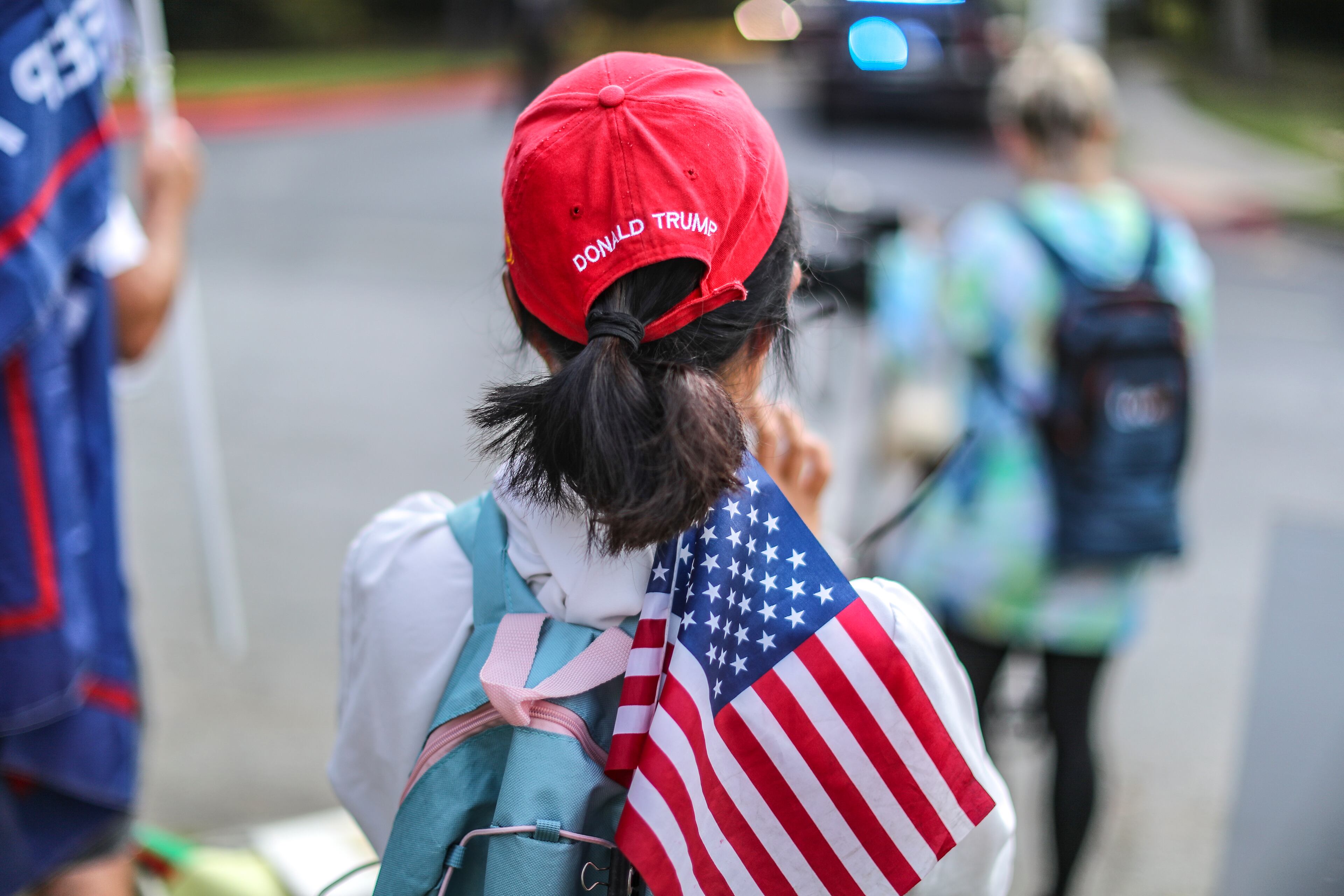 August 24, 2023 Atlanta: A woman who declined to give her name watches along Rive Street where by late Thursday morning, Aug. 24, 2023 there were more than 100 protestors gathered outside the jail, and they were prepared to wait for hours until the anticipated arrival of former President Donald Trump this afternoon. (John Spink / John.Spink@ajc.com)