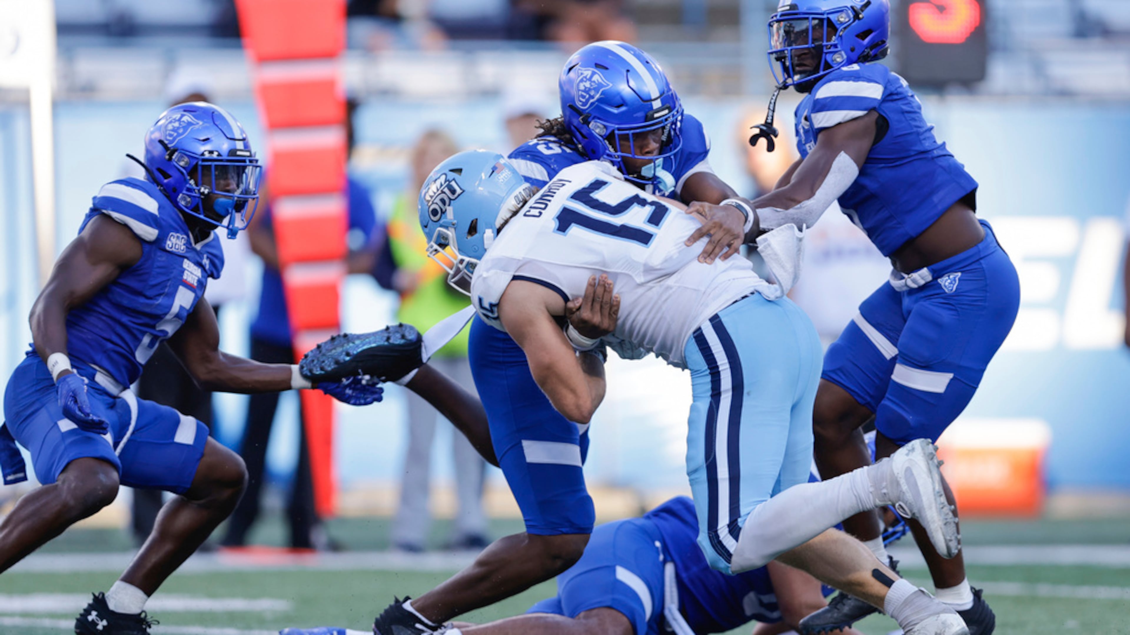 Georgia State linebacker Damaine Wilson (center, back), here making a tackle against Old Dominion in October, earned experience as a freshman last year and could be a starter this fall. (Stew Milne/AP 2024)