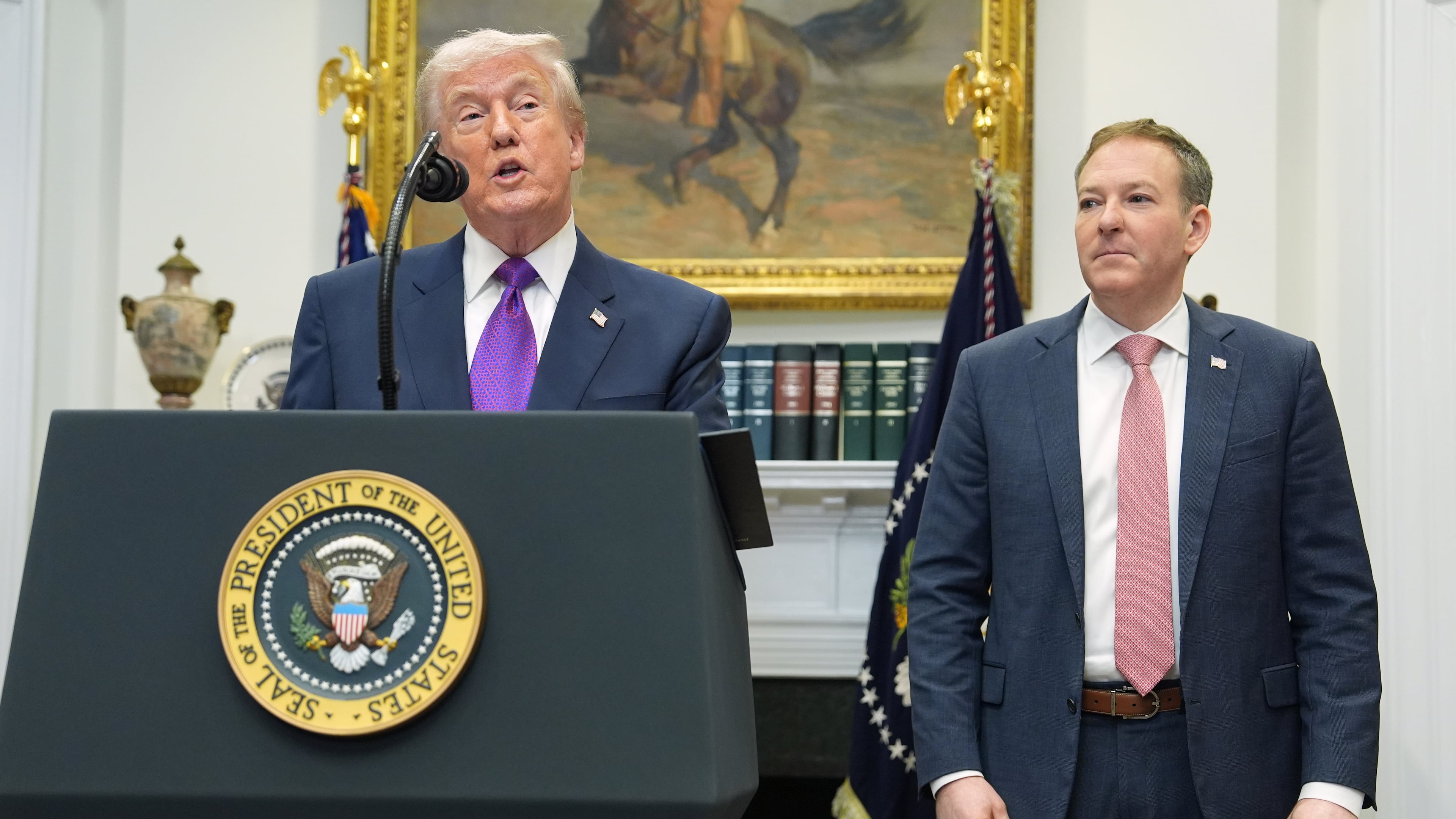 FILE - President Donald Trump, left, speaks during an event with Environmental Protection Agency director Lee Zeldin in the Roosevelt Room of the White House, Feb. 12, 2026, in Washington. (AP Photo/Evan Vucci, File)