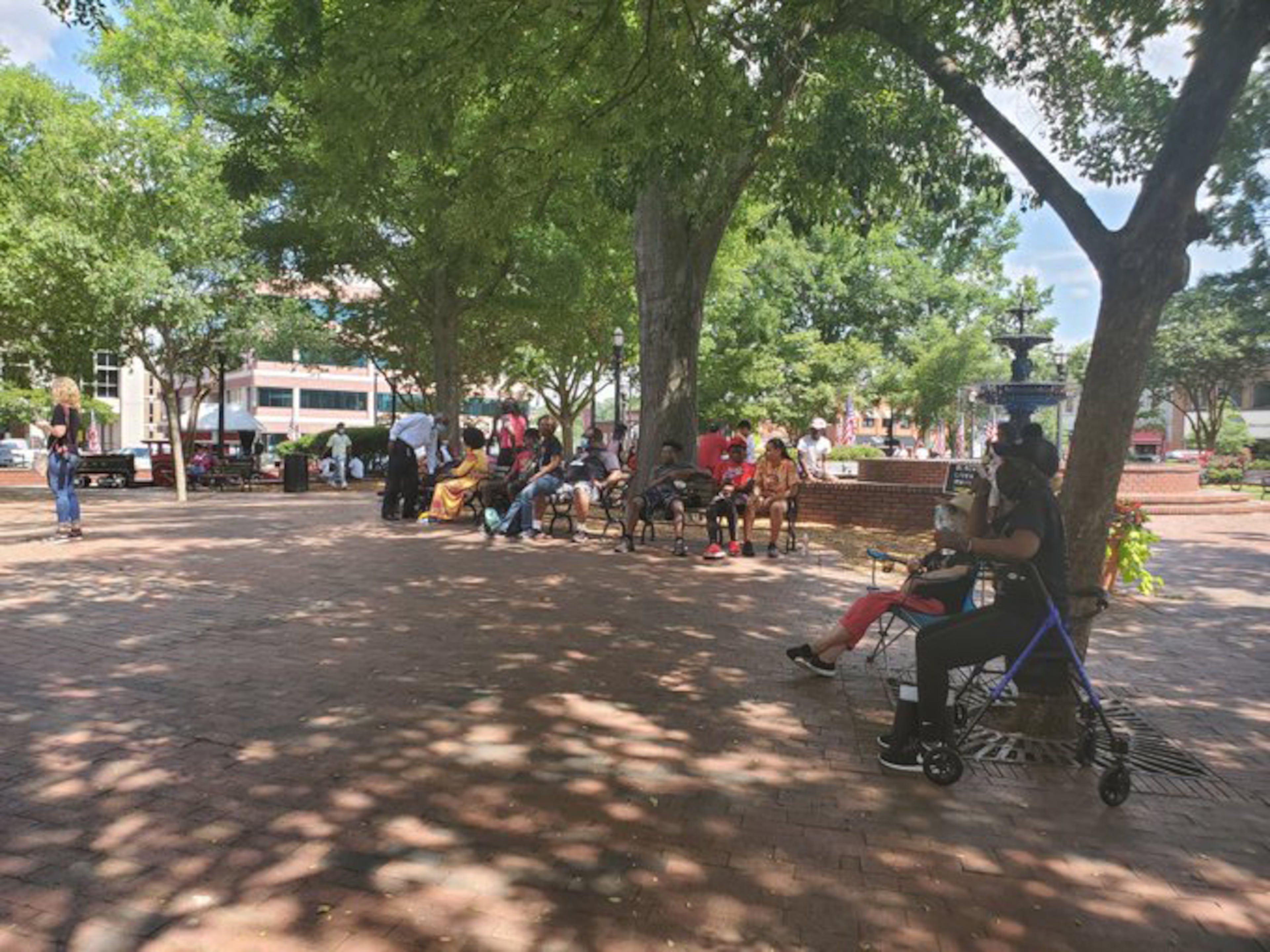 Several dozen people are already at Marietta Square for the Cobb NAACP Juneteenth march and rally. (Kristal Dixon / kristal.dixon@ajc.com)