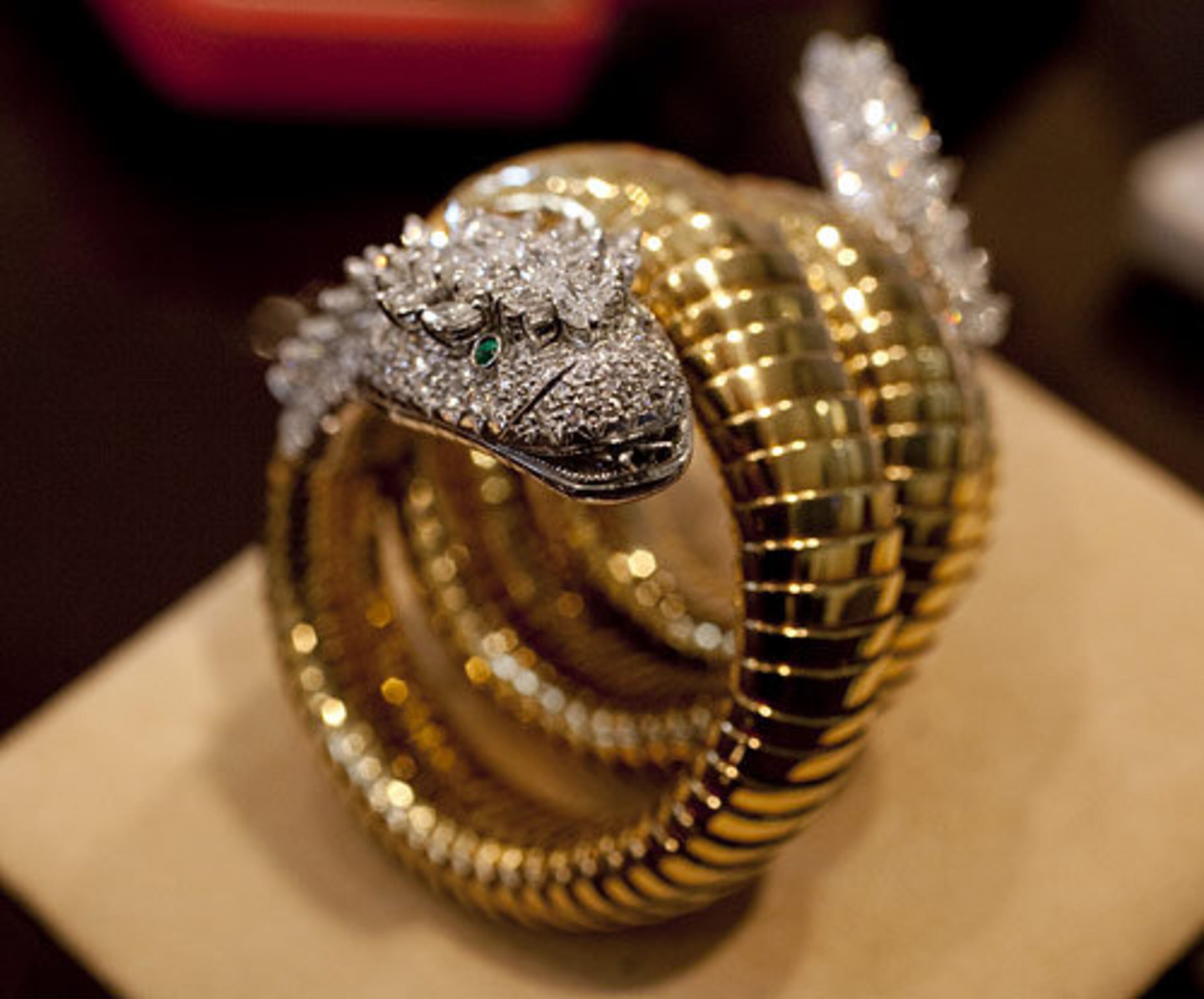 Taylor's diamond, emerald and gold "Snake" bracelet watch, by BVLGARI, circa 1961, estimated at $12,000 - $15,000. - AP