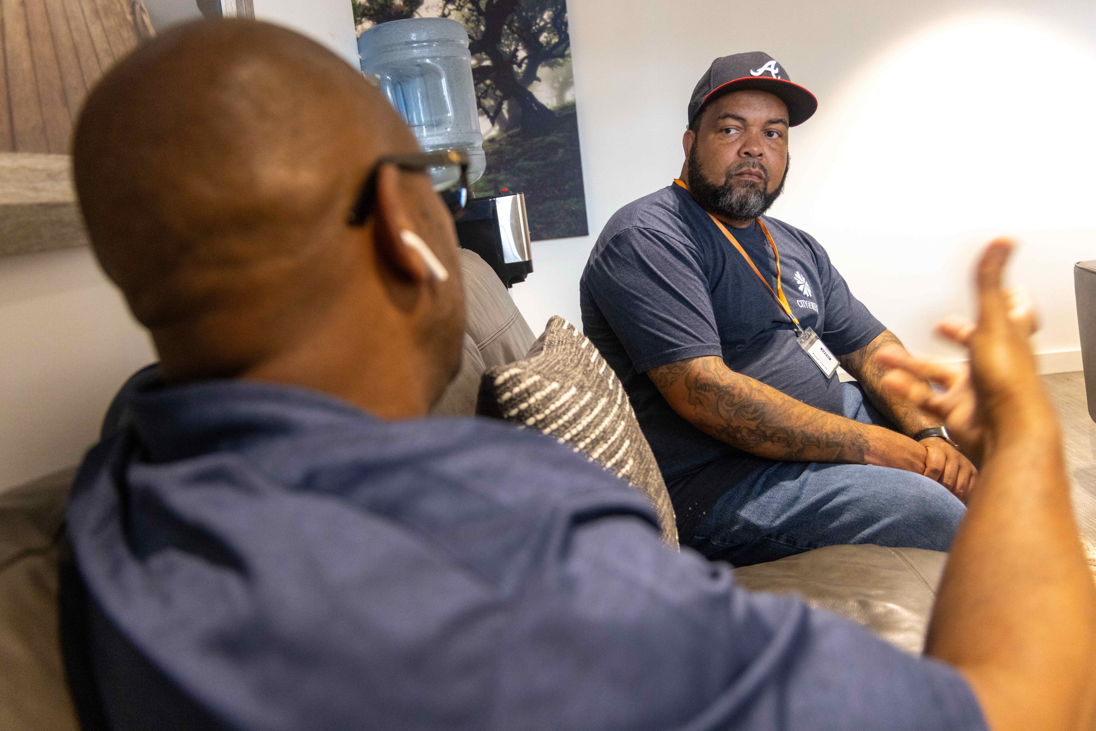 Greg Washington (left) met QuinKnoca Owens (right) when Owens was in jail awaiting parole and knew he could be successful working for the City of Refuge. (Phil Skinner for the AJC)