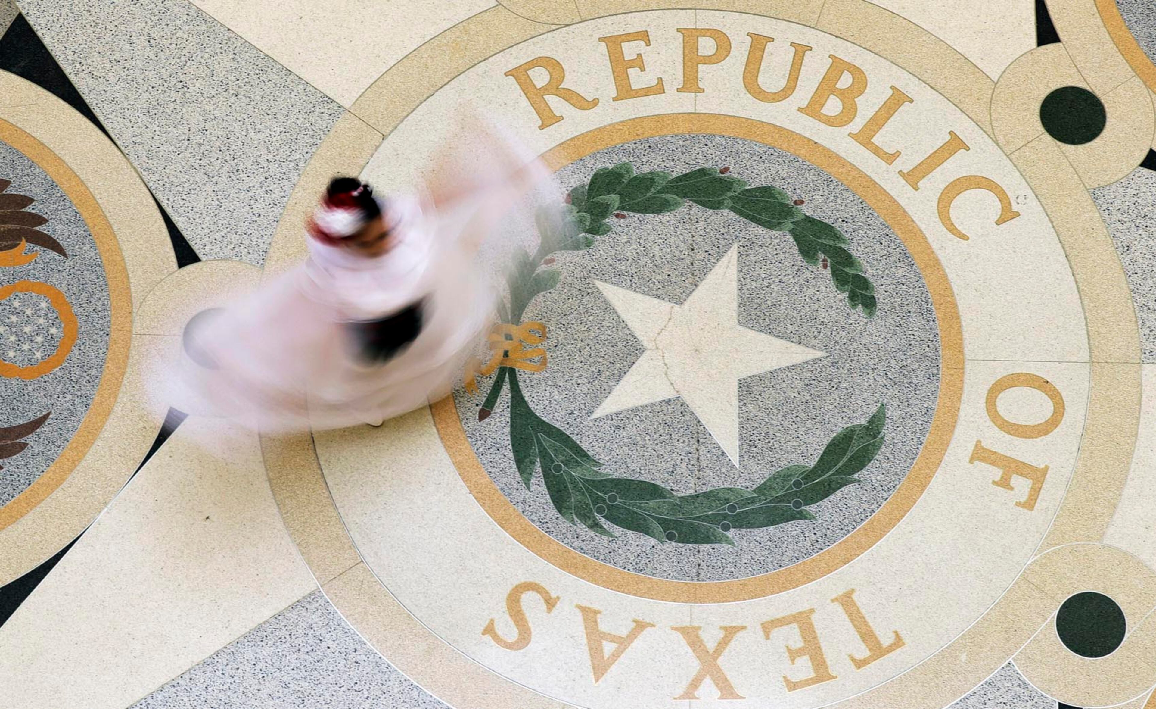 In this image taken with a slow shutter speed, Ballet Folklorico dancer Kasandra Lopez of Rio Grande City performs in the Rotunda of the Texas State Capitol, Wednesday, April 19, 2017, in Austin, Texas. (AP Photo/Eric Gay)