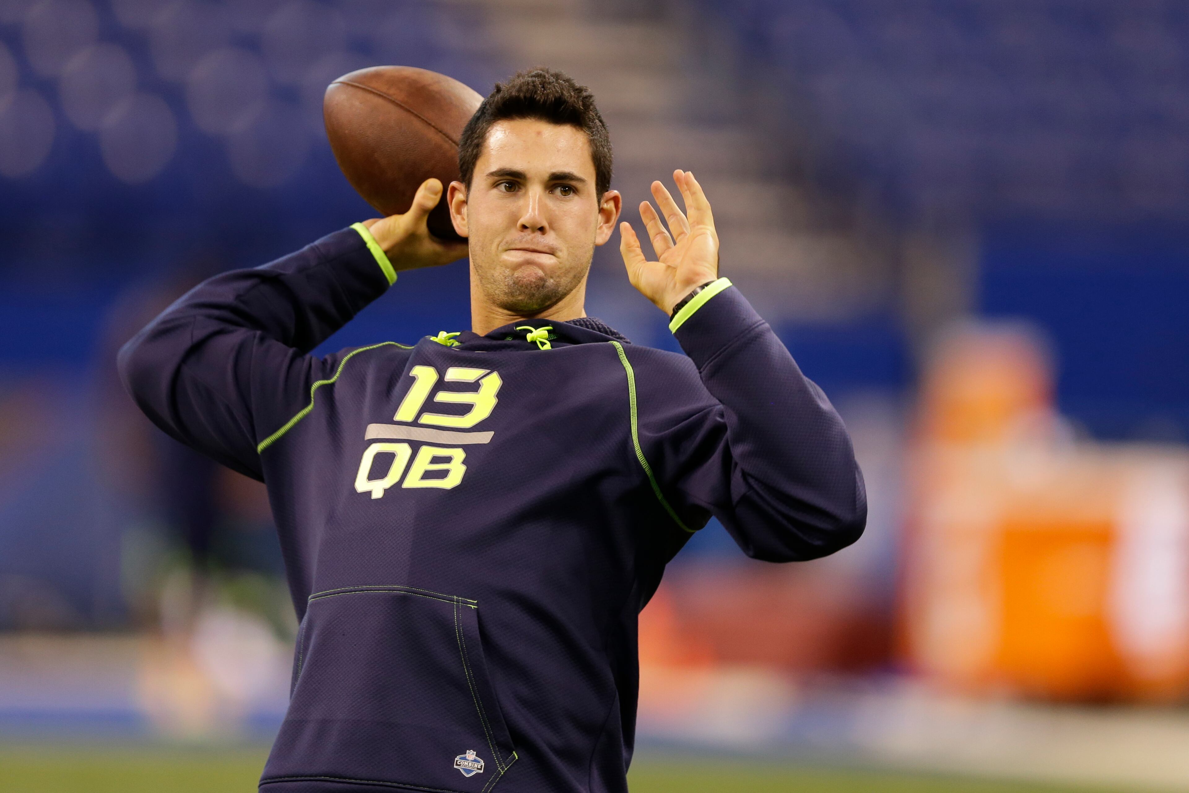 Georgia quarterback Aaron Murray throws during a drill at the NFL football scouting combine in Indianapolis, Sunday, Feb. 23, 2014. (AP Photo/Michael Conroy)