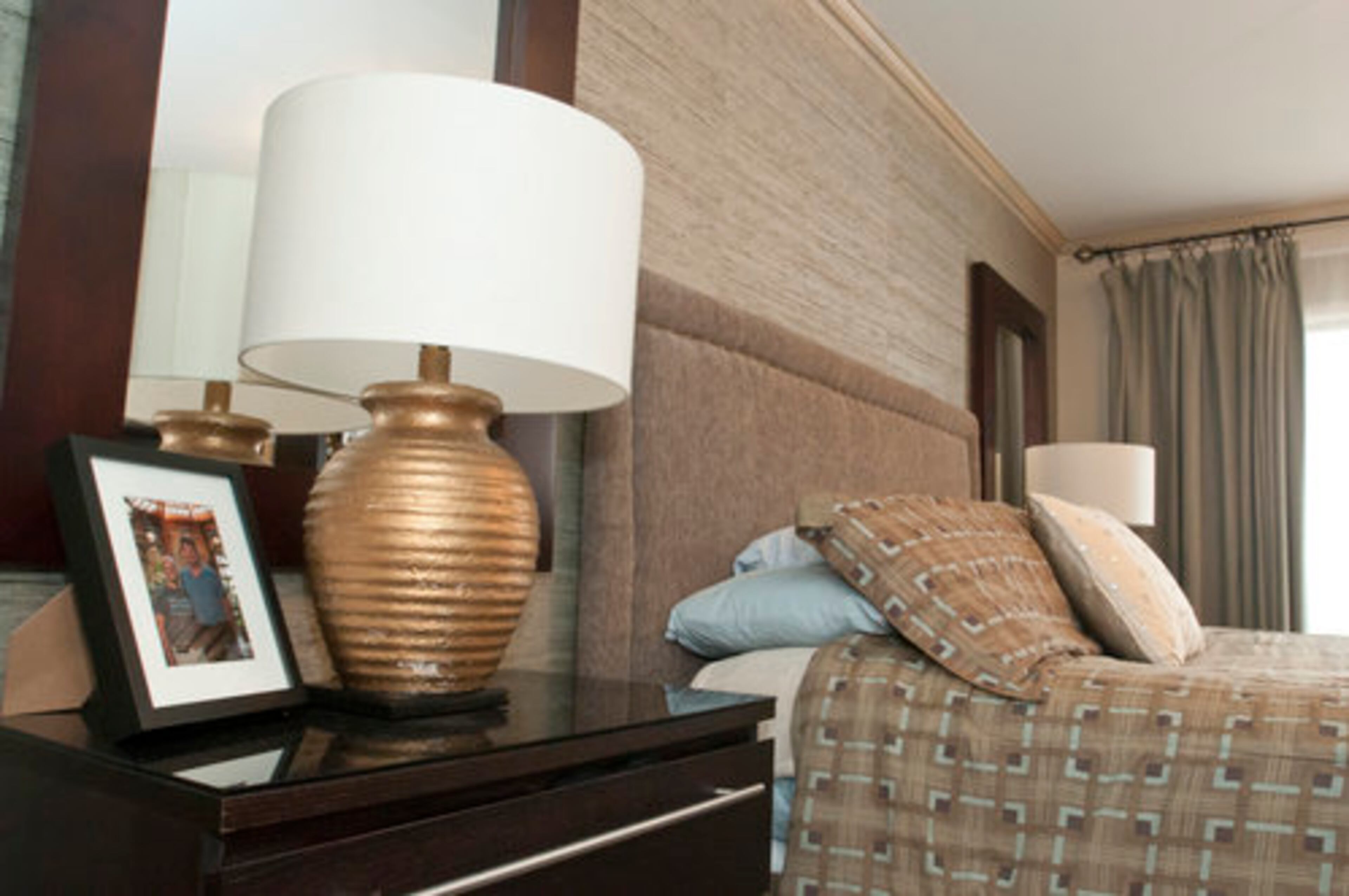 The wallpaper in the master bedroom is an arrowroot grass cloth from Phillip Jeffries Ltd. I wanted to make sure that I kept the color palette light so I painted the walls Benjamin Moore Lenox Tan and did a darker trim Benjamin Moore Greenbriar Beige.