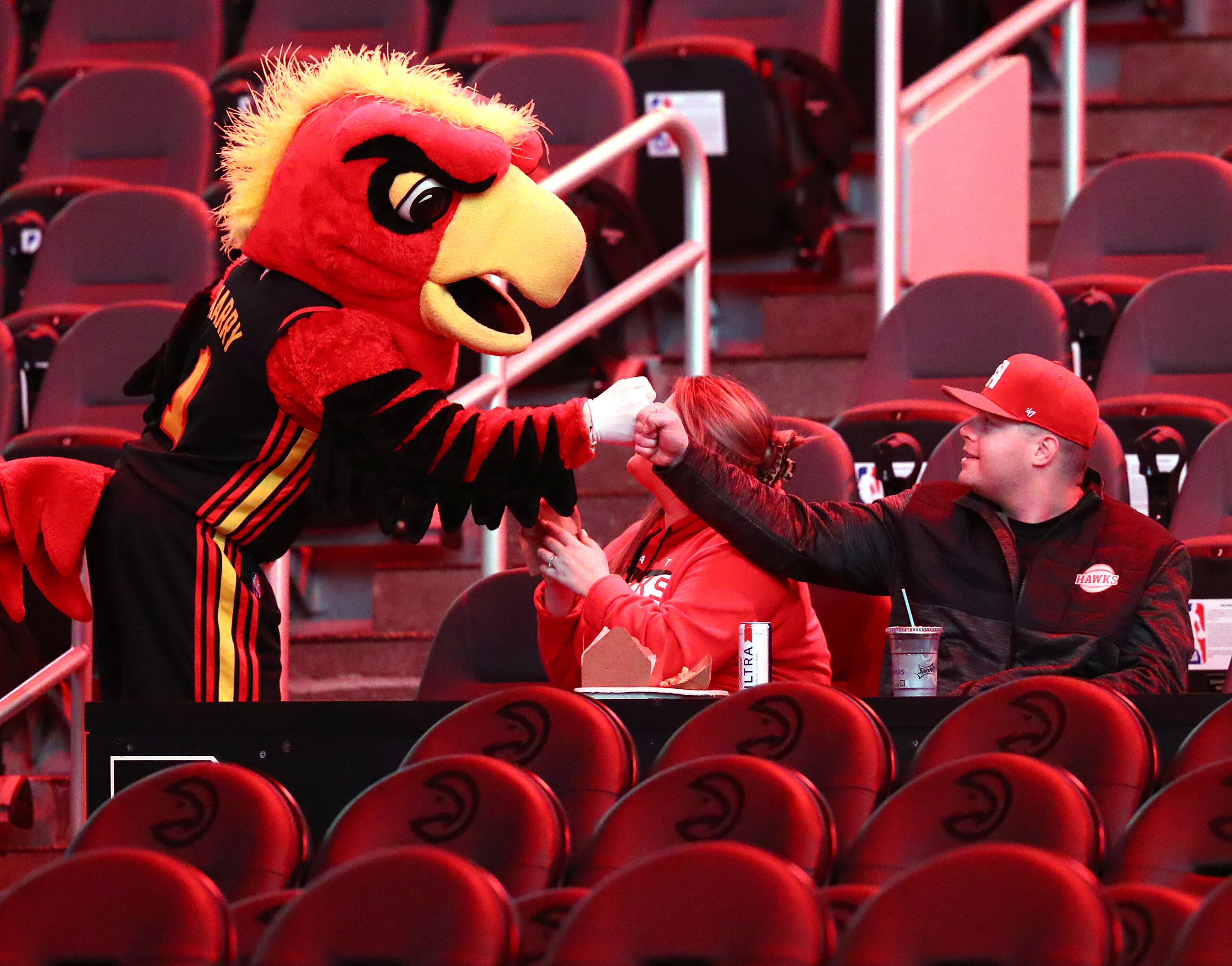 Harry the Hawk gives fans a fist bump. “Curtis Compton / Curtis.Compton@ajc.com”
