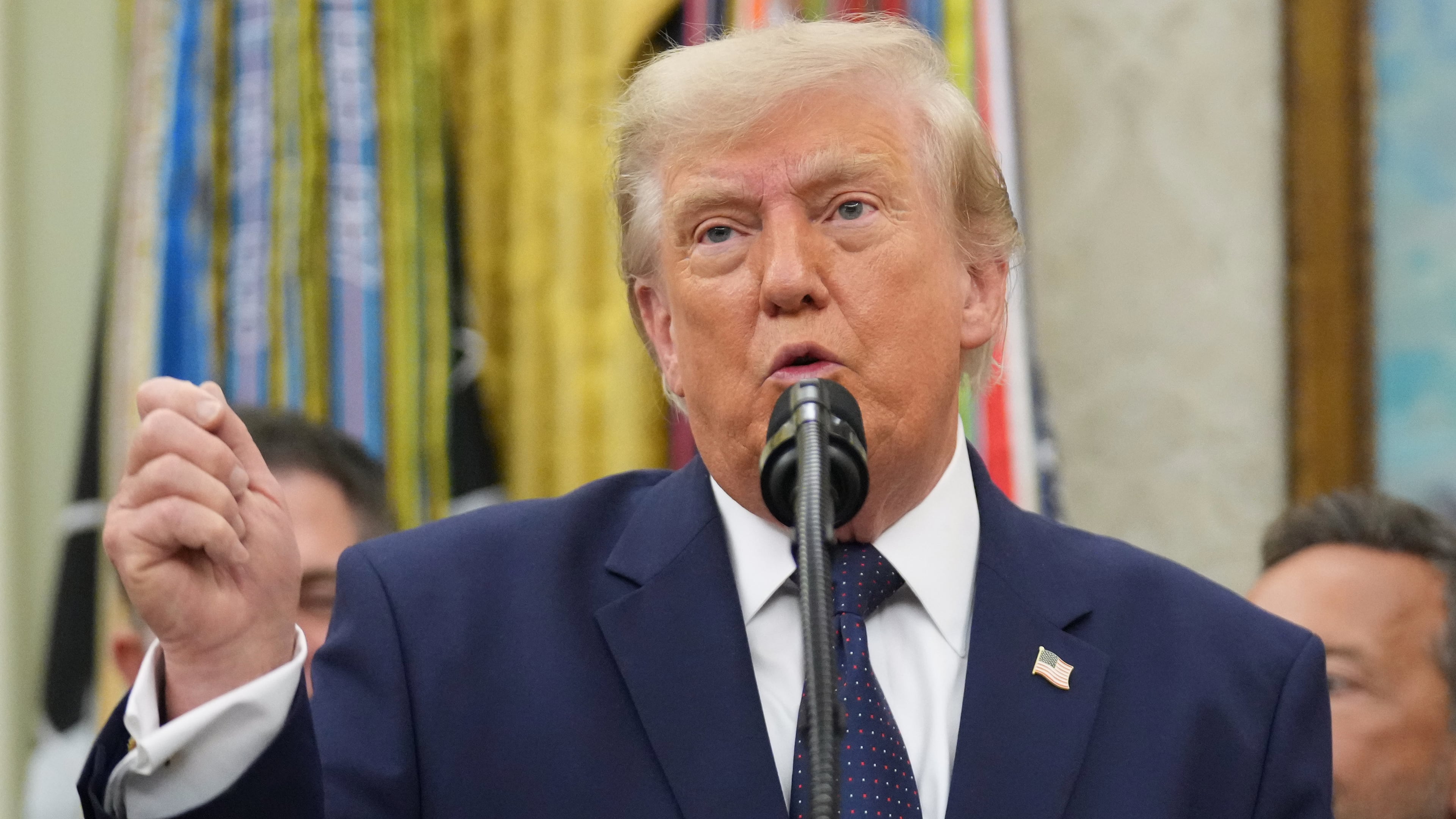 President Donald Trump speaks about FIFA after ringing the opening bell for the New York Stock Exchange and the Nasdaq in the Oval Office at the White House, Monday, July 6, 2026, in Washington. (AP Photo/Mark Schiefelbein)