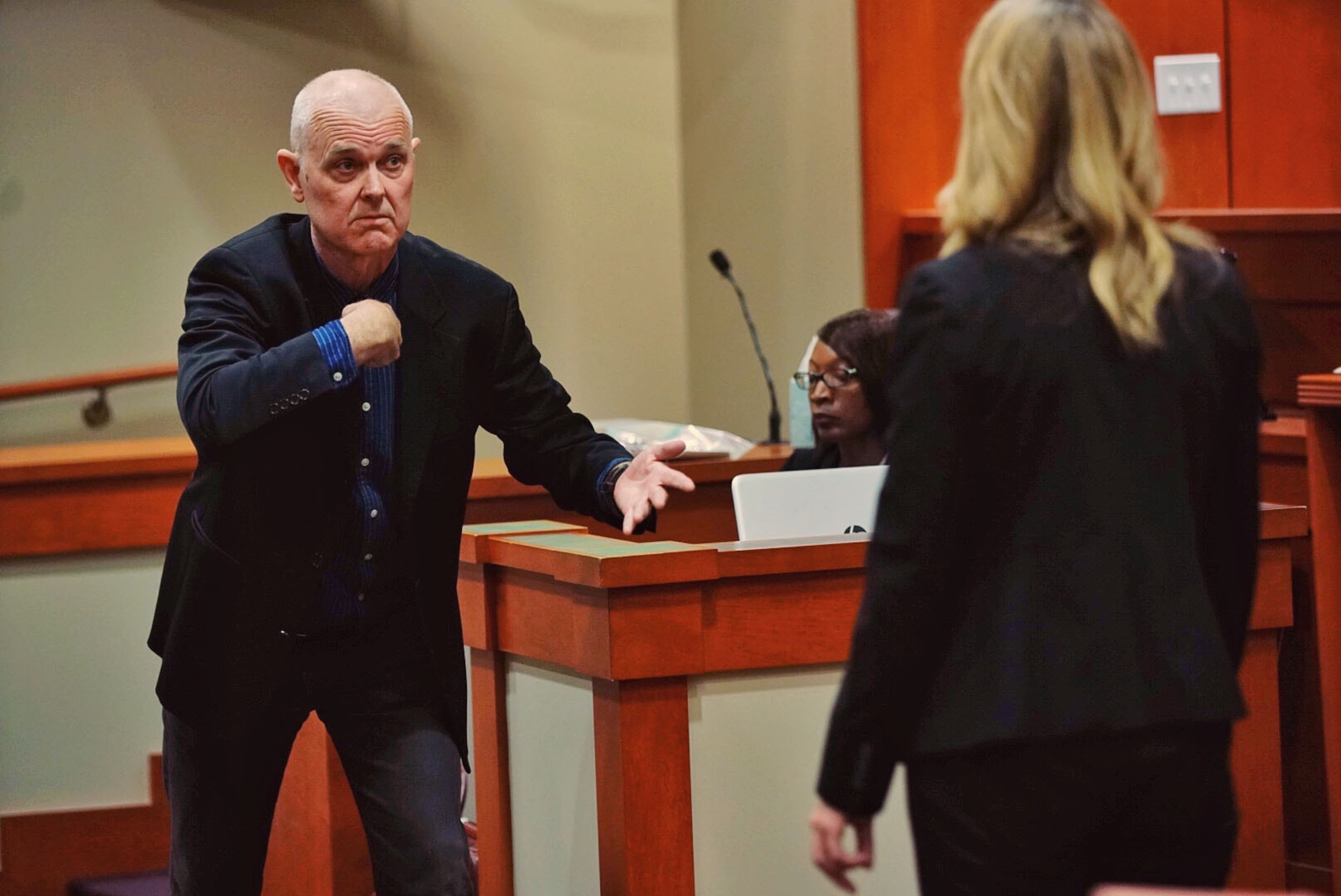 Dr. Geoffrey Smith, deputy chief medical examiner at the Dekalb County Medical Examiner's office, testifies while being questioned by defense attorney Amanda Clark Palmer during day three of the Robert Olson murder trial at the DeKalb County Courthouse on October 1, 2019 in Decatur. Olsen is charged with murdering war veteran Anthony Hill. (Elijah Nouvelage for The Atlanta Journal Constitution)