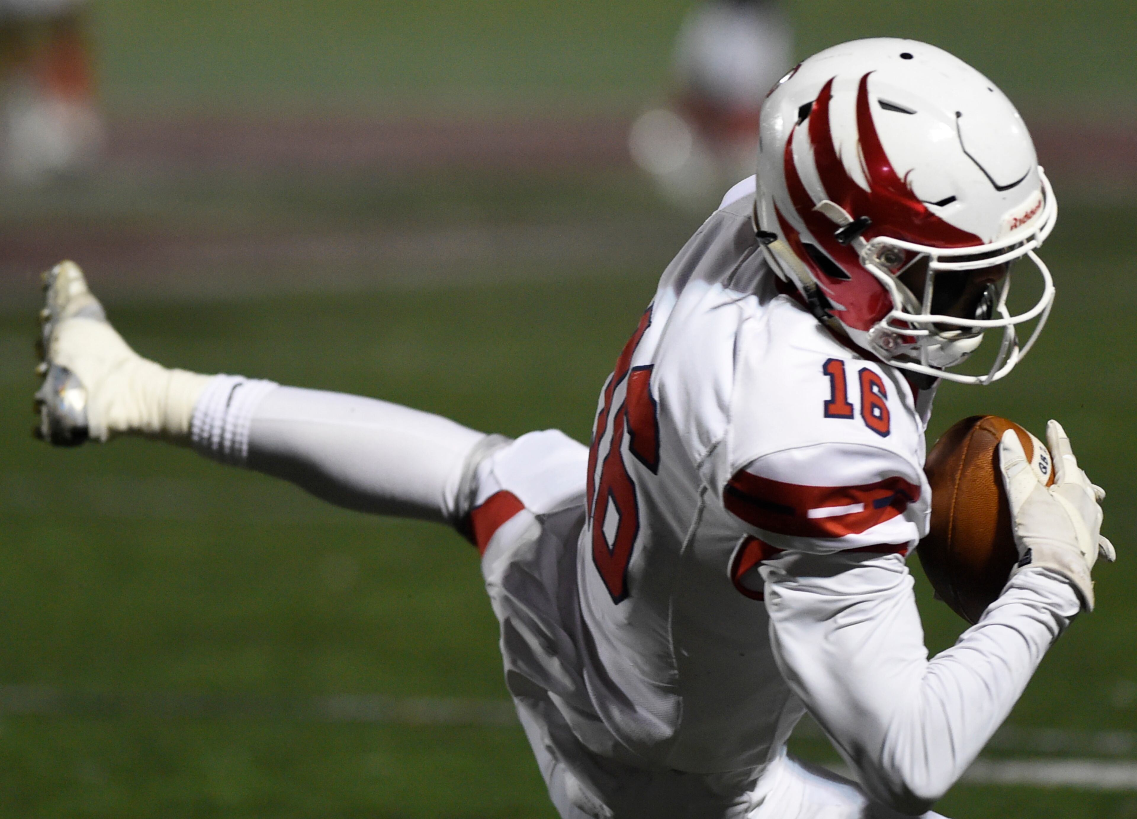 Milton's Holden Shaw catches the ball during the second half of the game against Hillgrove, Friday, Nov. 23, 2018, in Powder Springs, Georgia. (Annie Rice/AJC)