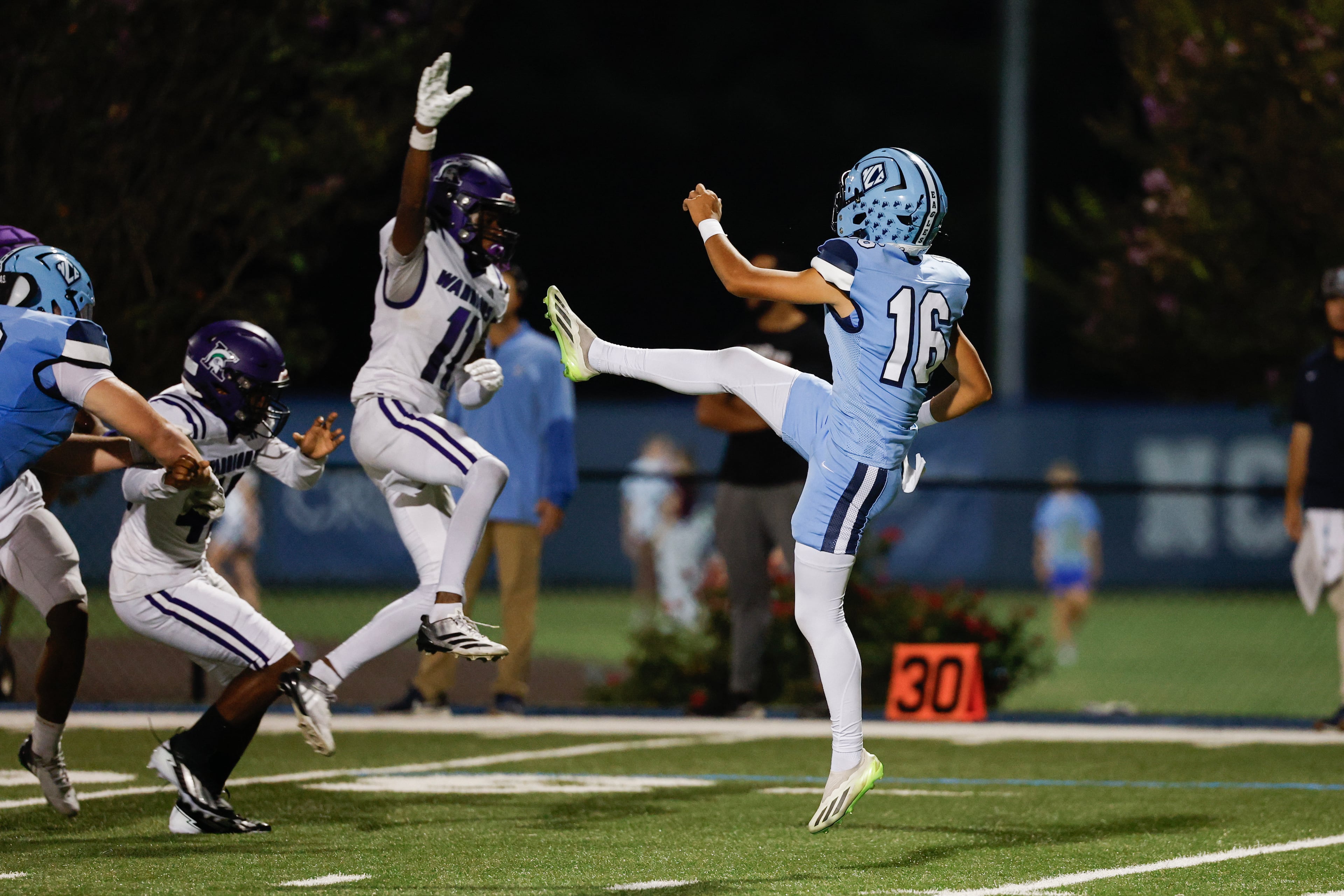 North Cobb Christian’s Daniel Rivera (right) punts under pressure from KIPP Atlanta’s Deangelo Weston during their game on Friday, Oct. 2, 2026, in Kennesaw. (Erik S. Lesser for the AJC)
