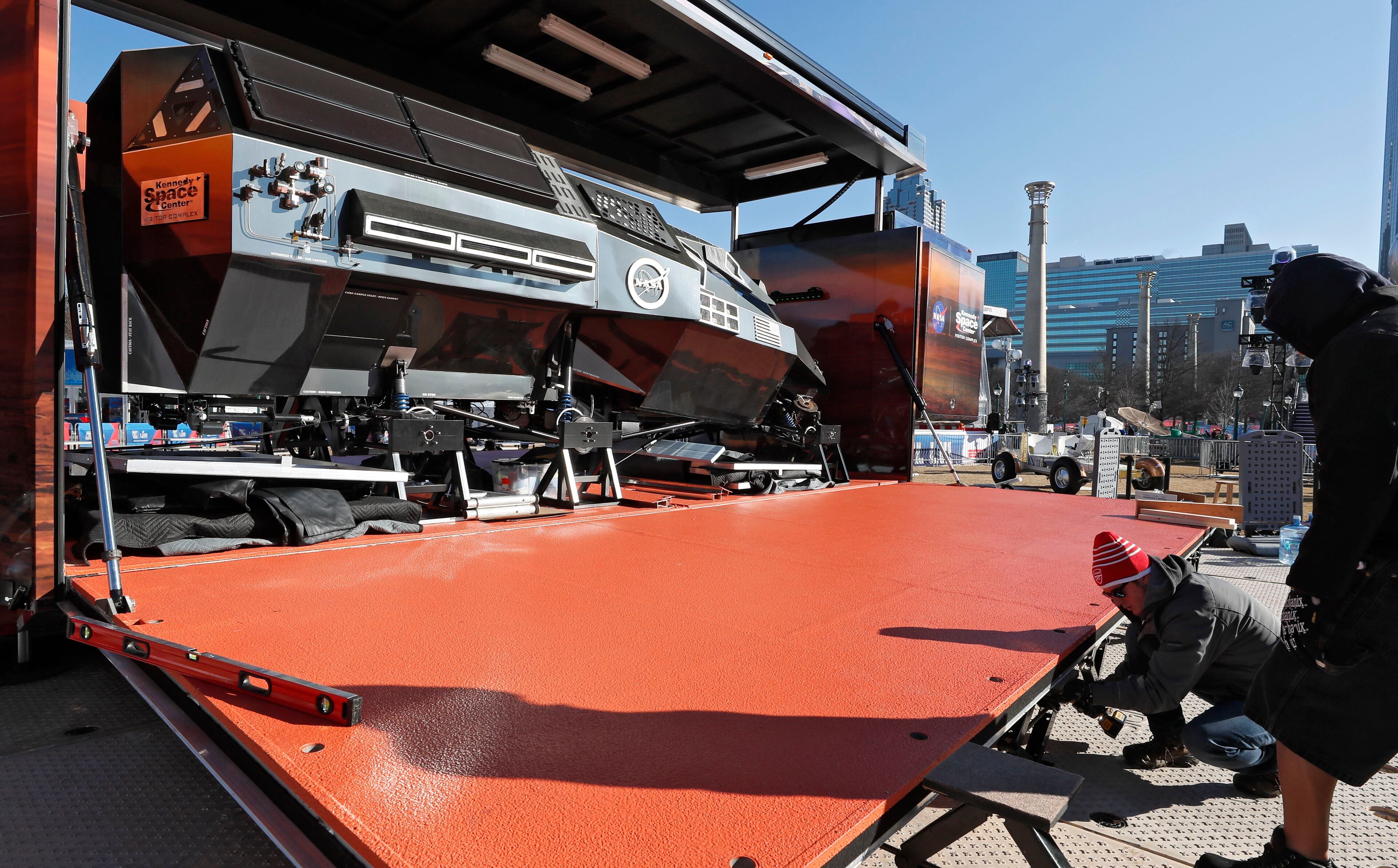 1/25/19 - Atlanta - Workers set up the Kennedy Space Center exhibit at Super Bowl Live in Centennial Park. Crews work to get Super Bowl LIII's official fan attractions, Super Bowl LIVE presented by Verizon, Super Bowl Experience Driven by Hyundai and NFL Shop at Super Bowl LIII presented by Visa, ready for opening day on Saturday. Bob Andres / bandres@ajc.com