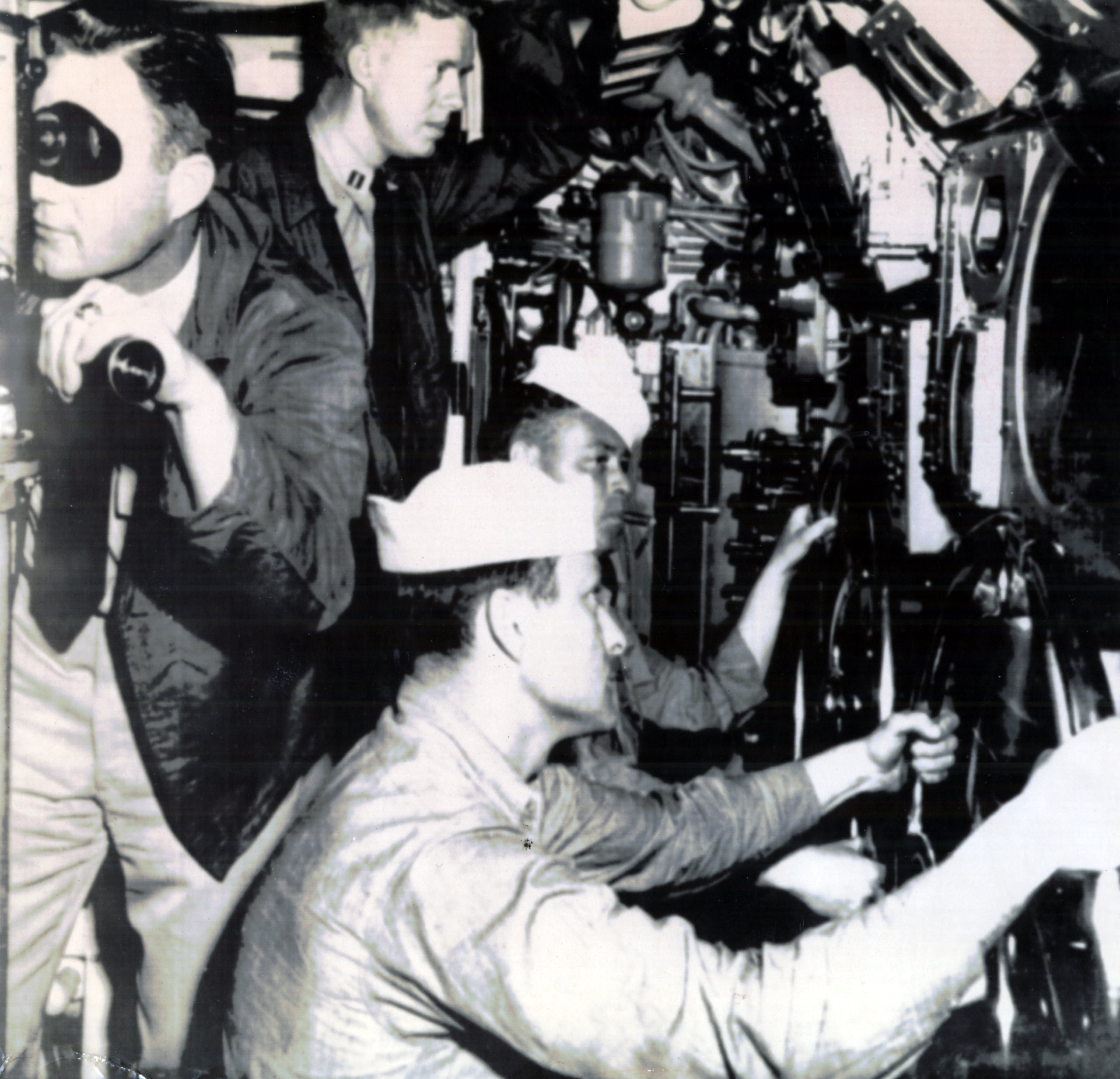 1952: Jimmy Carter's active naval service lasted from 1946-1953. (He's seen here in 1952, in the top center in the background looking at instruments on the submarine USS K-1.) During that time, the couple lived in Norfolk, Va., and had their first three children -- John, James and Jeffrey. (Amy was born in 1967.) (AP file)