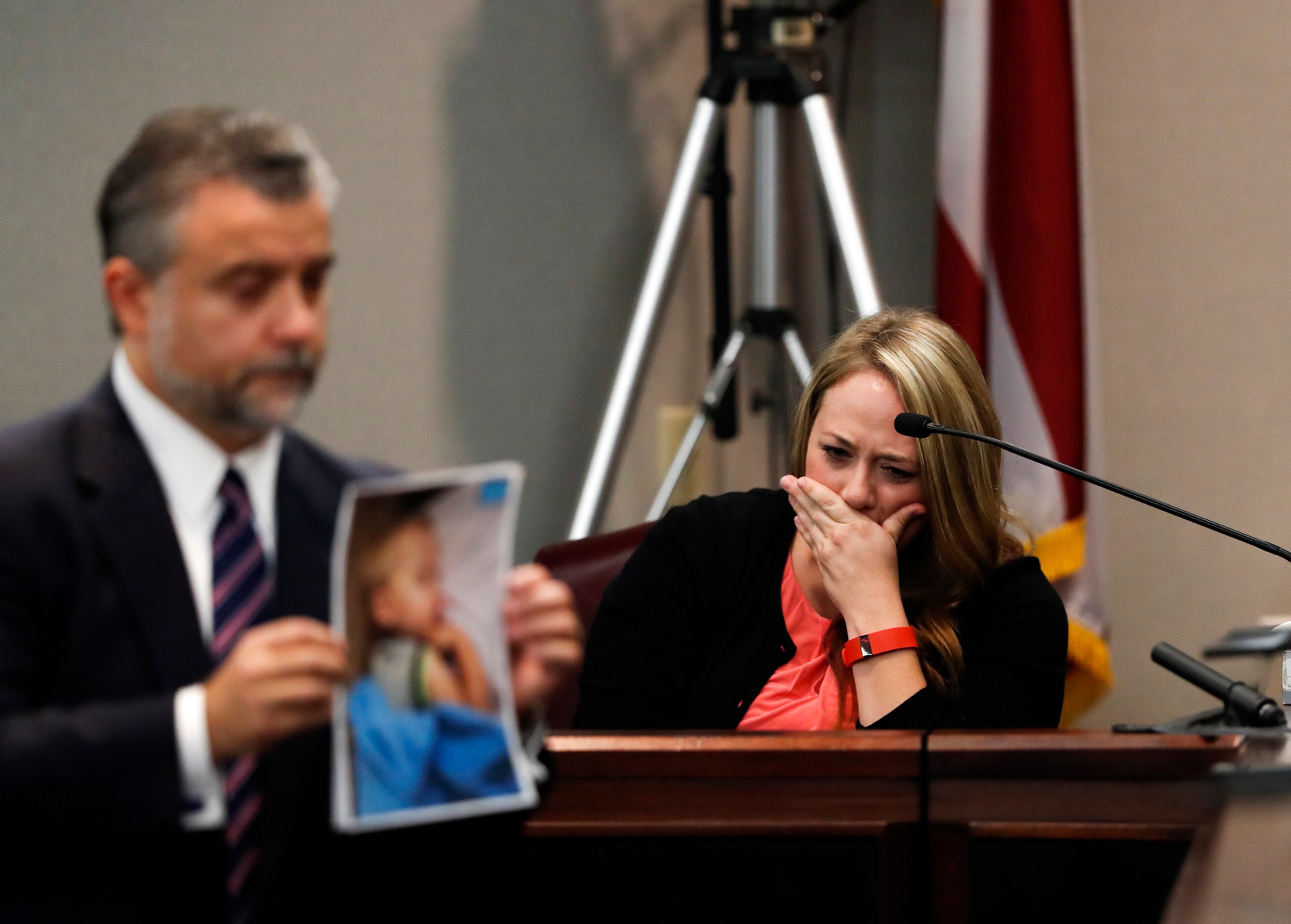 Leanna Taylor cries as defense attorney Maddox Kilgore shows the jury a picture of her son Cooper during a murder trial for her ex-husband Justin Ross Harris who is accused of intentionally killing Cooper in June 2014 by leaving him in the car in suburban Atlanta, Monday, Oct. 31, 2016, in Brunswick, Ga. (AP Photo/John Bazemore, Pool)