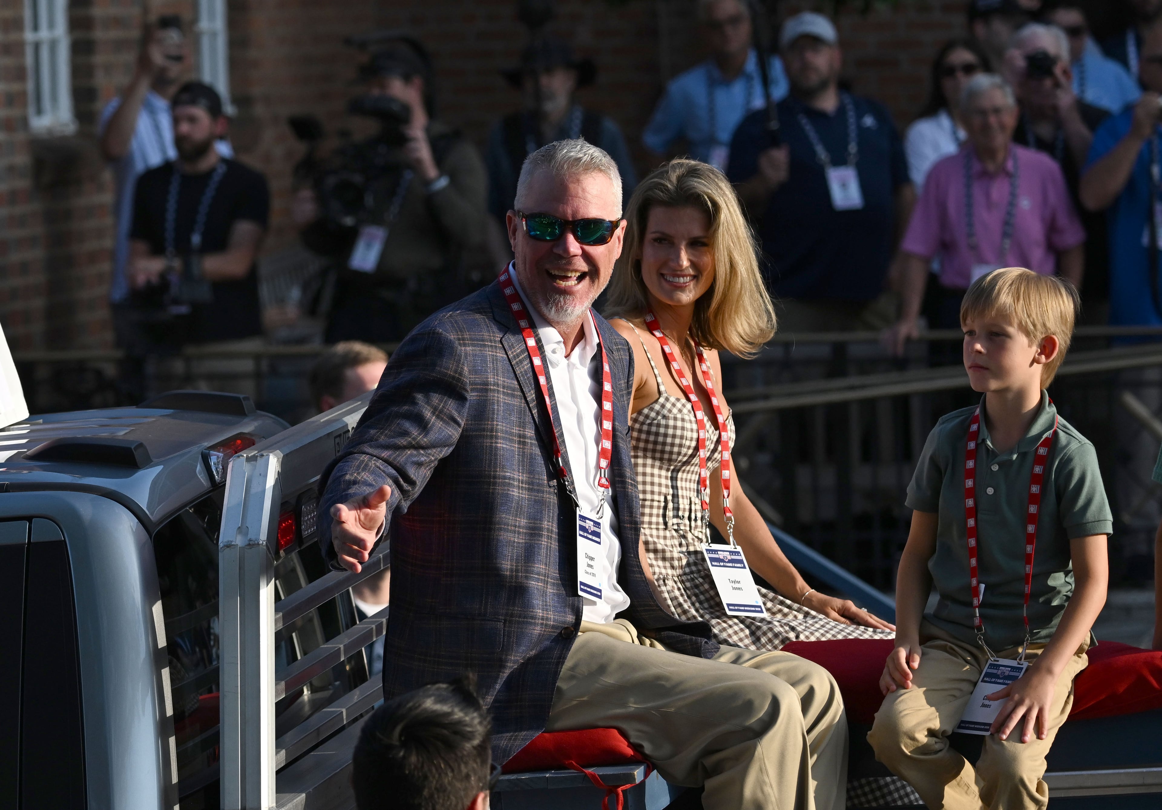 National Baseball Hall of Fame member and former Brave Chipper Jones waves to spectators from the back of a pickup truck during the Hall of Fame Legends Parade on Saturday, July 25, 2026, in Cooperstown, N.Y. (Hyosub Shin/AJC)