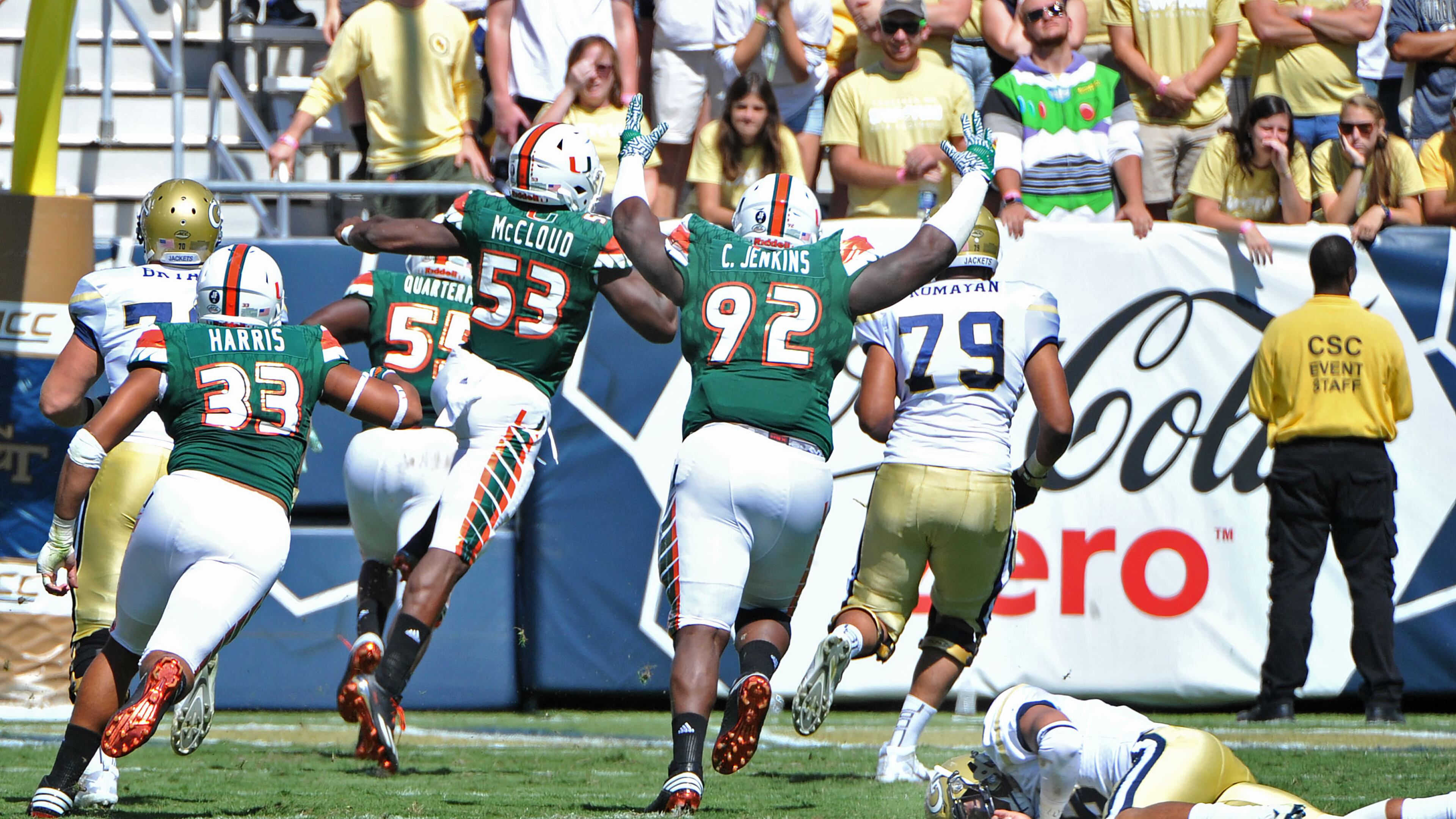 Georgia Tech quarterback Justin Thomas falls down as Miami linebacker Shaquille Quarterman (55) runs for a touchdown after he picked up Thomas’ fumble the ball in the first half at Bobby Dodd Stadium Saturday. HYOSUB SHIN / HSHIN@AJC.COM
